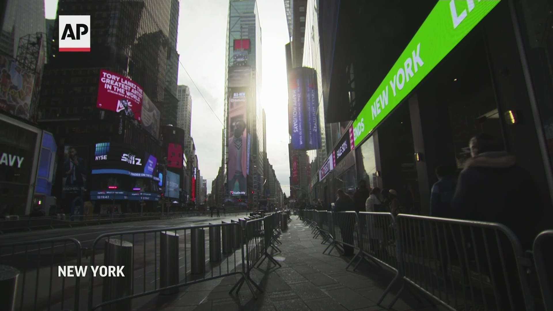 The normally bustling streets of New York's Times Square were vacant on New Year's Eve as police fenced off a perimeter to maintain social distancing.