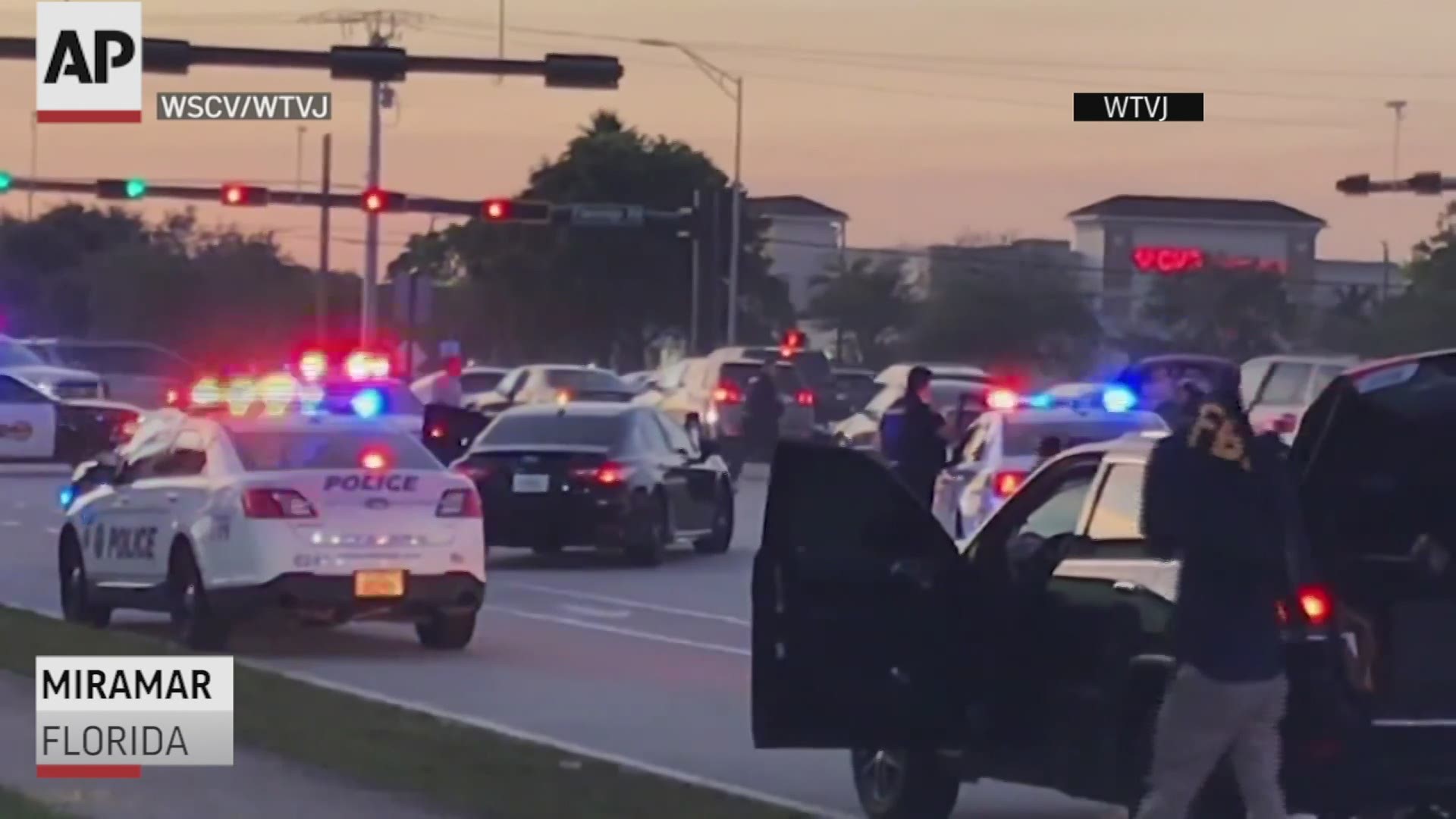 A WCSV/WTVJ photographer captured the moments that a fatal shootout began in Miami between police and armed robbers.