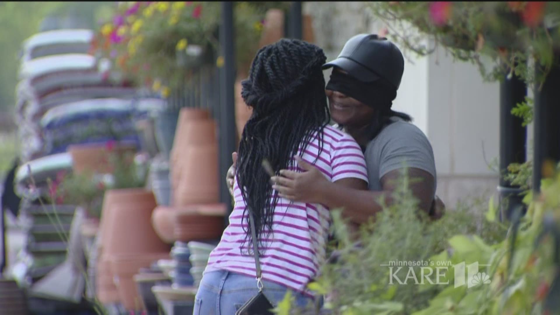 A week after Hurricane Harvey exacted its wrath, Shameka Carter stood near the entrance of a Houston grocery store, palms up, arms extended, giving hugs. Because Houston is hurting - and so is she. http://kare11.tv/2iSOZTX