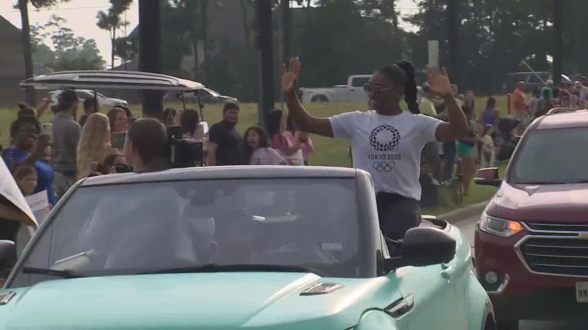 Crowds went to the airport to greet Simone Biles and teammate Jordan Chiles. Then crowds gathered in Spring for their return there.