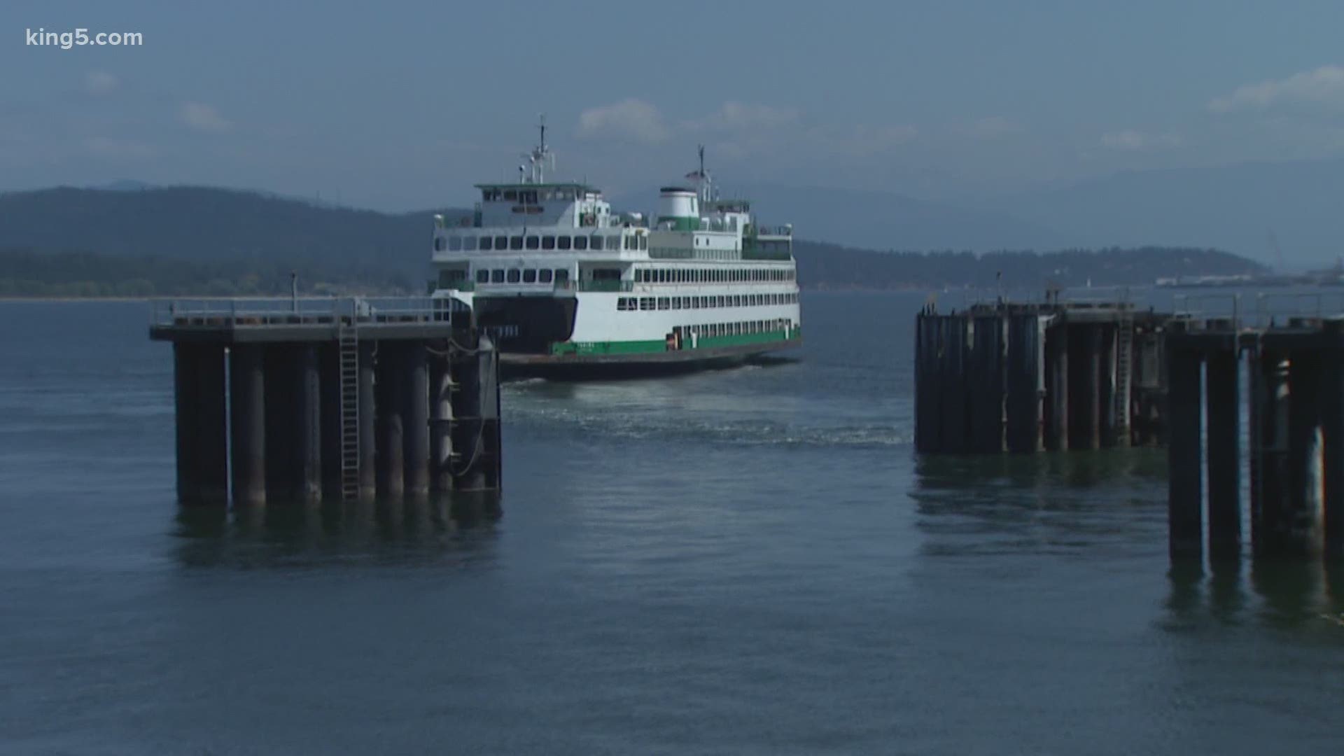 The Washington State Ferry system says fallout from coronavirus is to blame for long ferry lines.