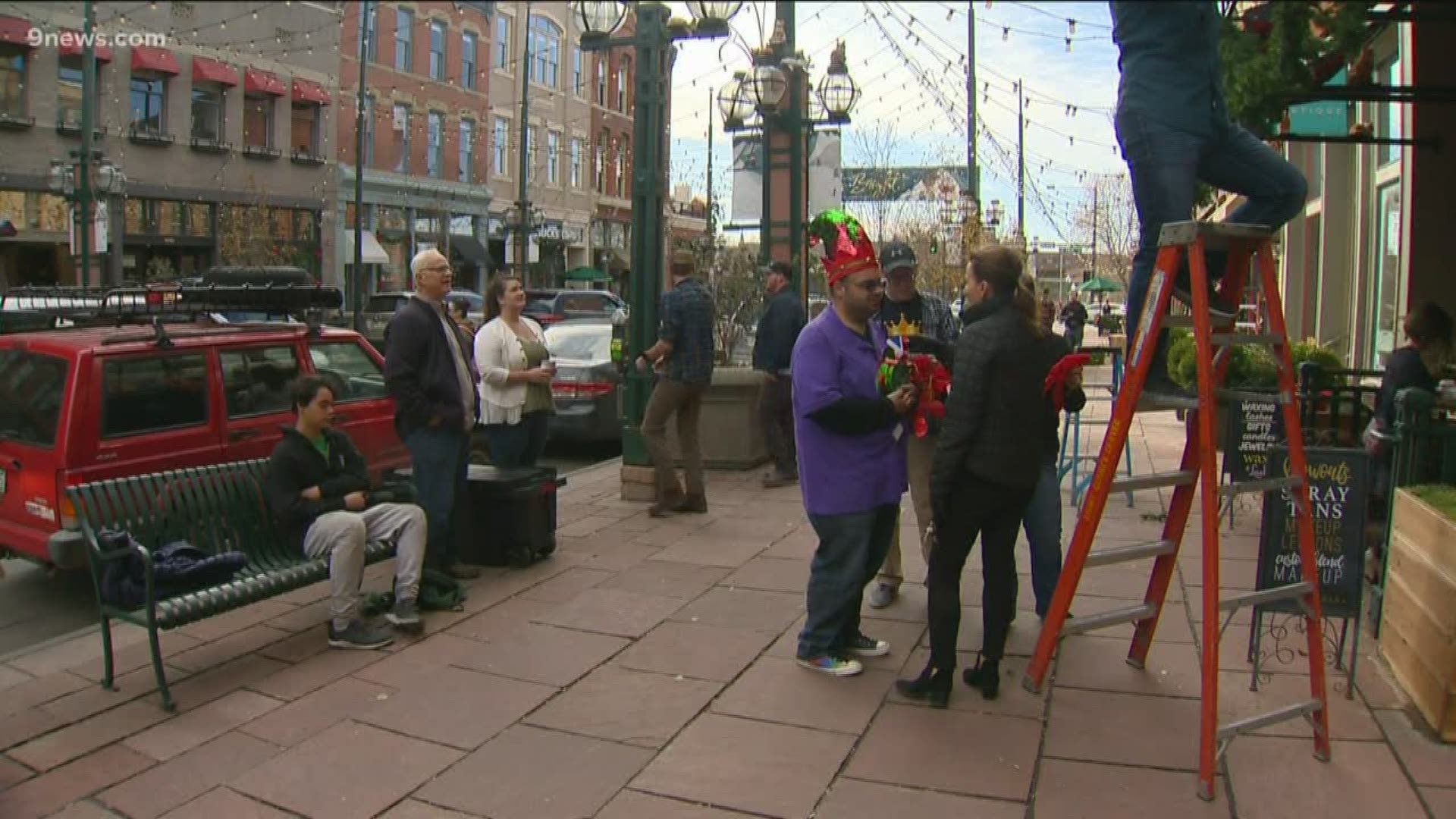 The singing group has been decorating the street for 30 years -- a privilege they don't take for granted.