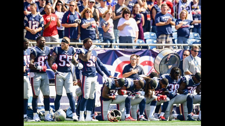 Seahawks come out for national anthem: Nine players sit, rest of team  stands