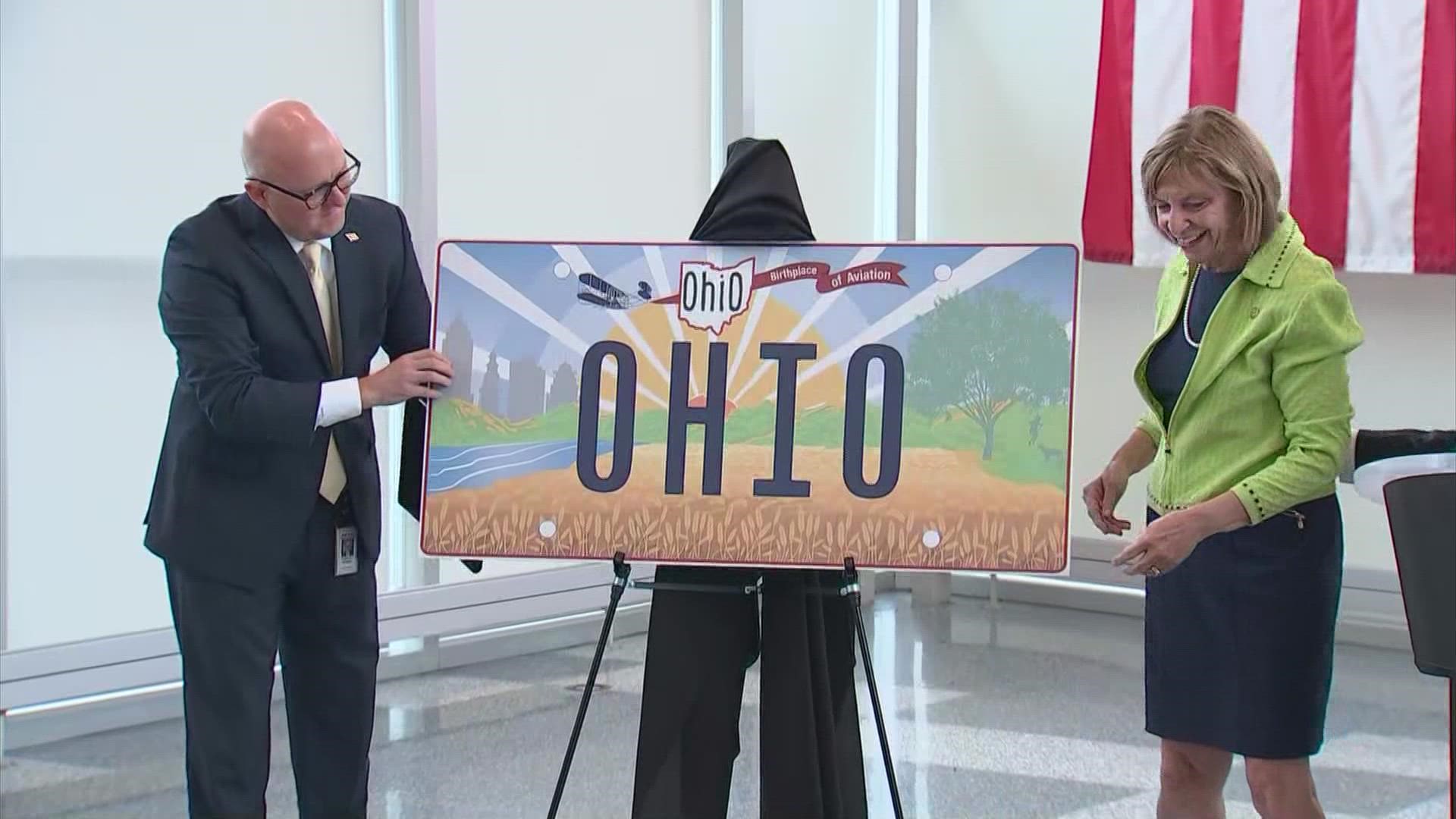 Gov. Mike DeWine unveiled the new license plate Thursday. The plane on the design was pushing the "Birthplace of Aviation" banner instead of pulling it.