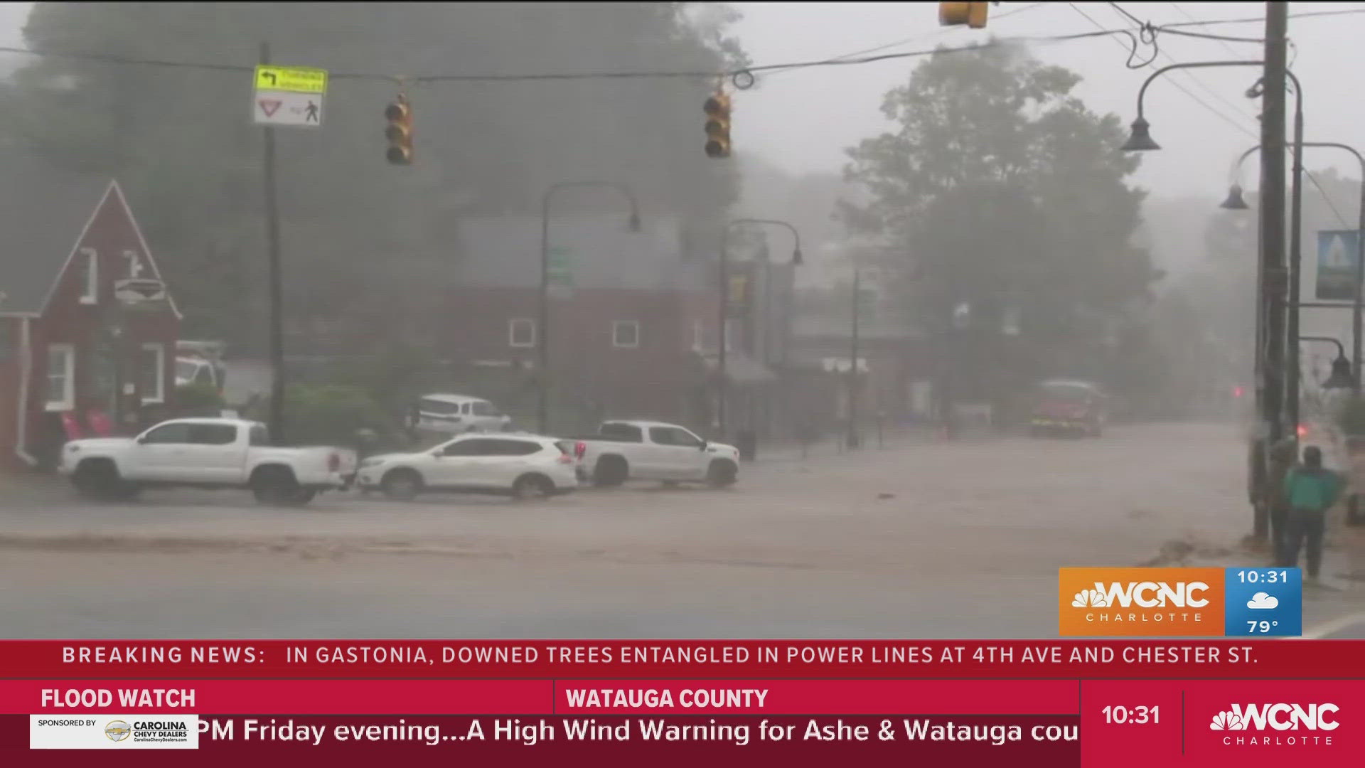 King Street was flooded by several inches of rushing water Friday morning as Tropical Storm Helene brought torrential rain to the Carolinas.