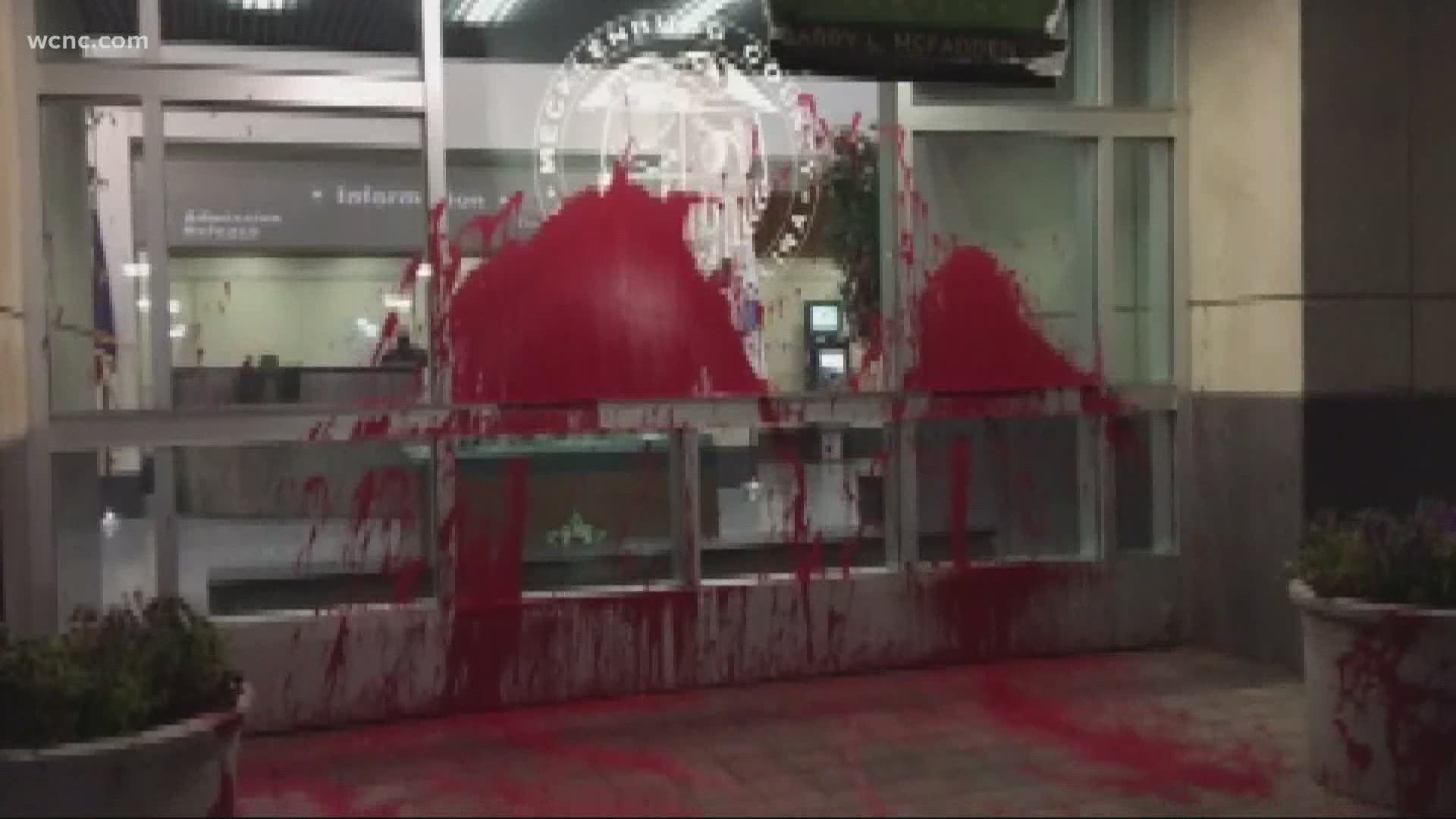 Protesters vandalized the jail on Sunday night by throwing red paint on the entrance doors.