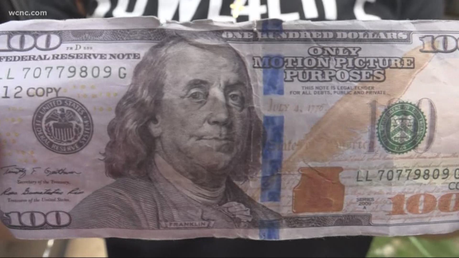 Fake $100 bills were left on several cars near a popular Belmont restaurant