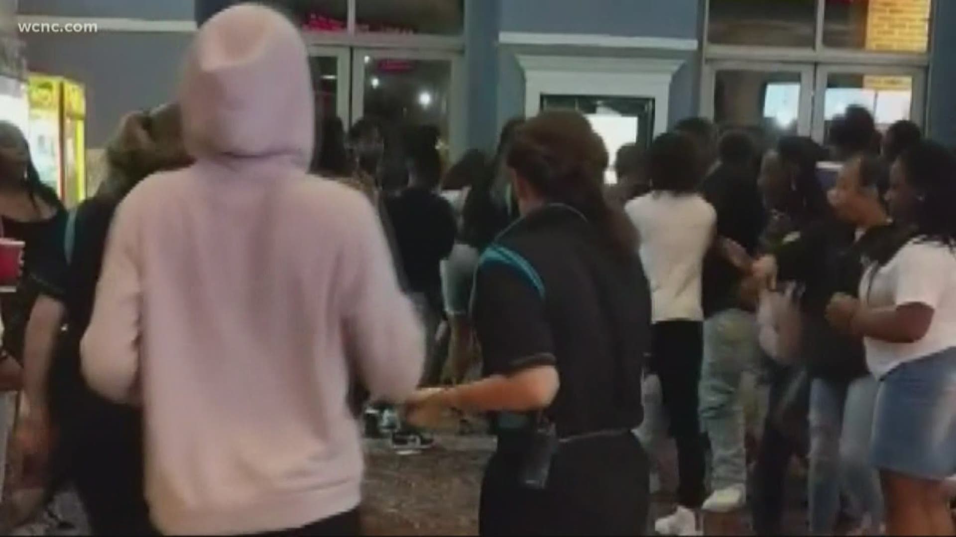 There were dozens fighting and dozens more watching, and it was all caught on camera. Some theater employees attempted to get the fight under control, while movie-goers called the police.