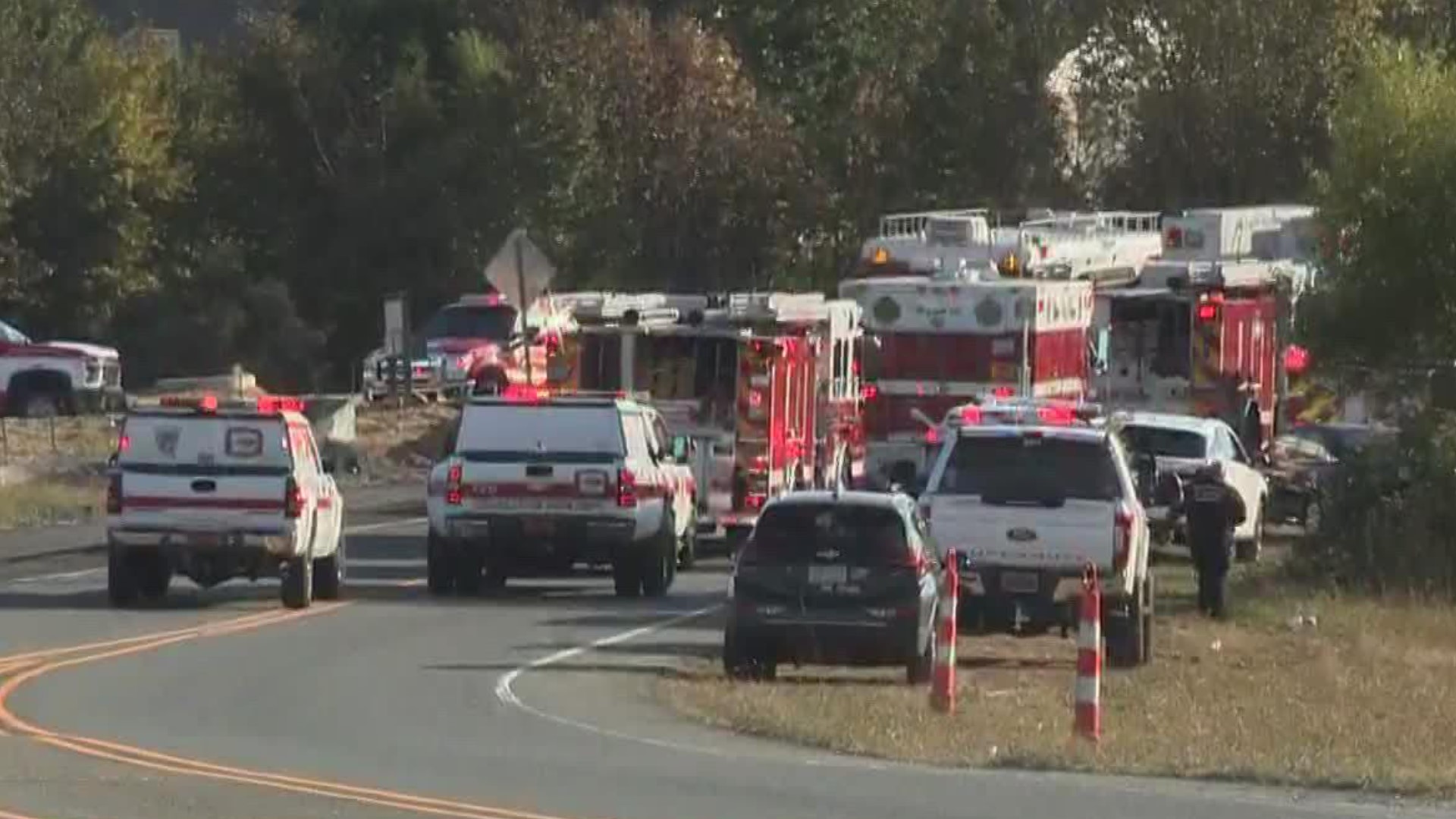 Firefighters are trying to reach a person trapped in a trench in Monroe.