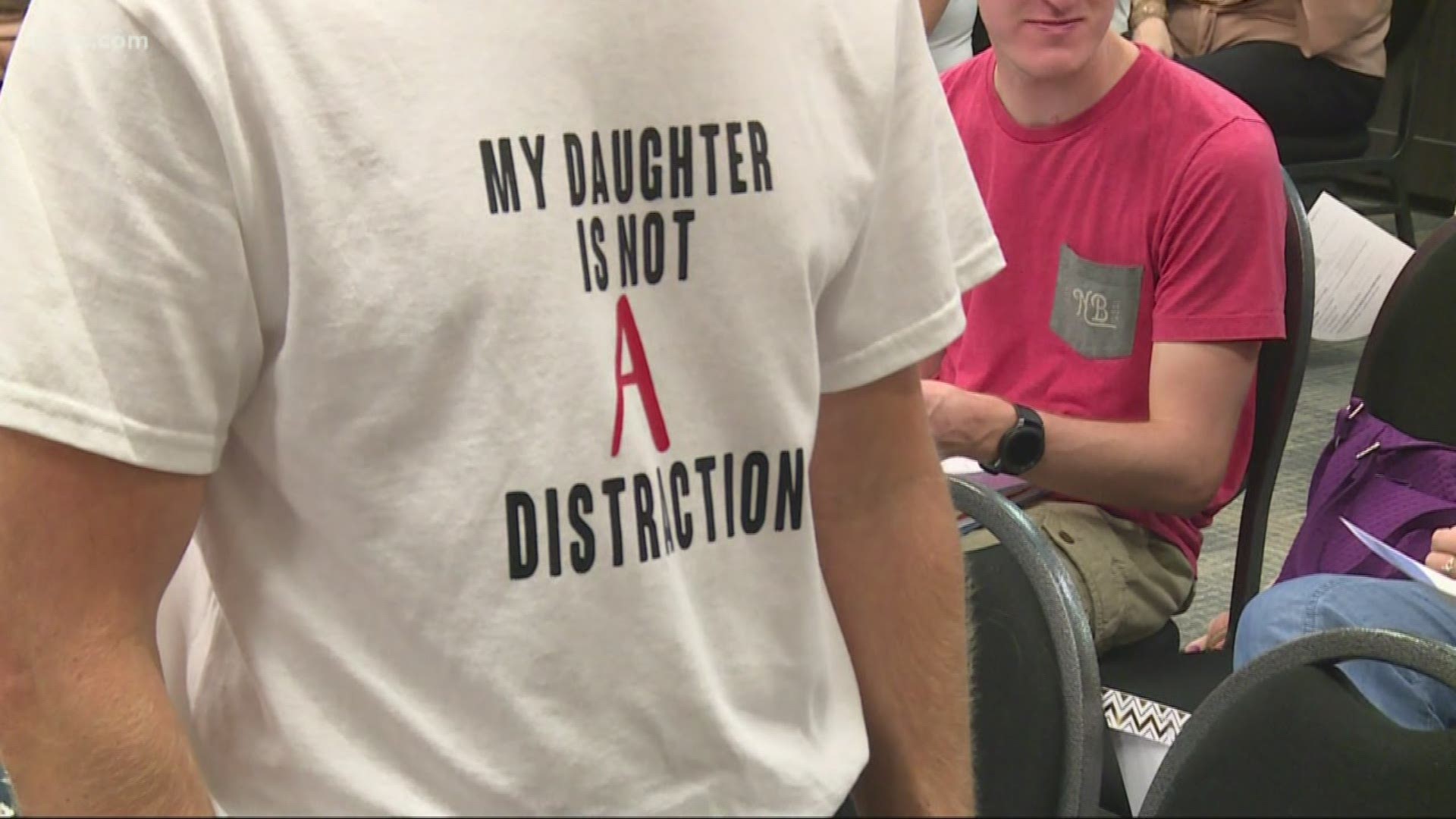 The school board heard powerful personal stories, including from a brave sixth grader. For the dozens of people who didn't step up to the mic, some of them were wearing their message on their shirts.