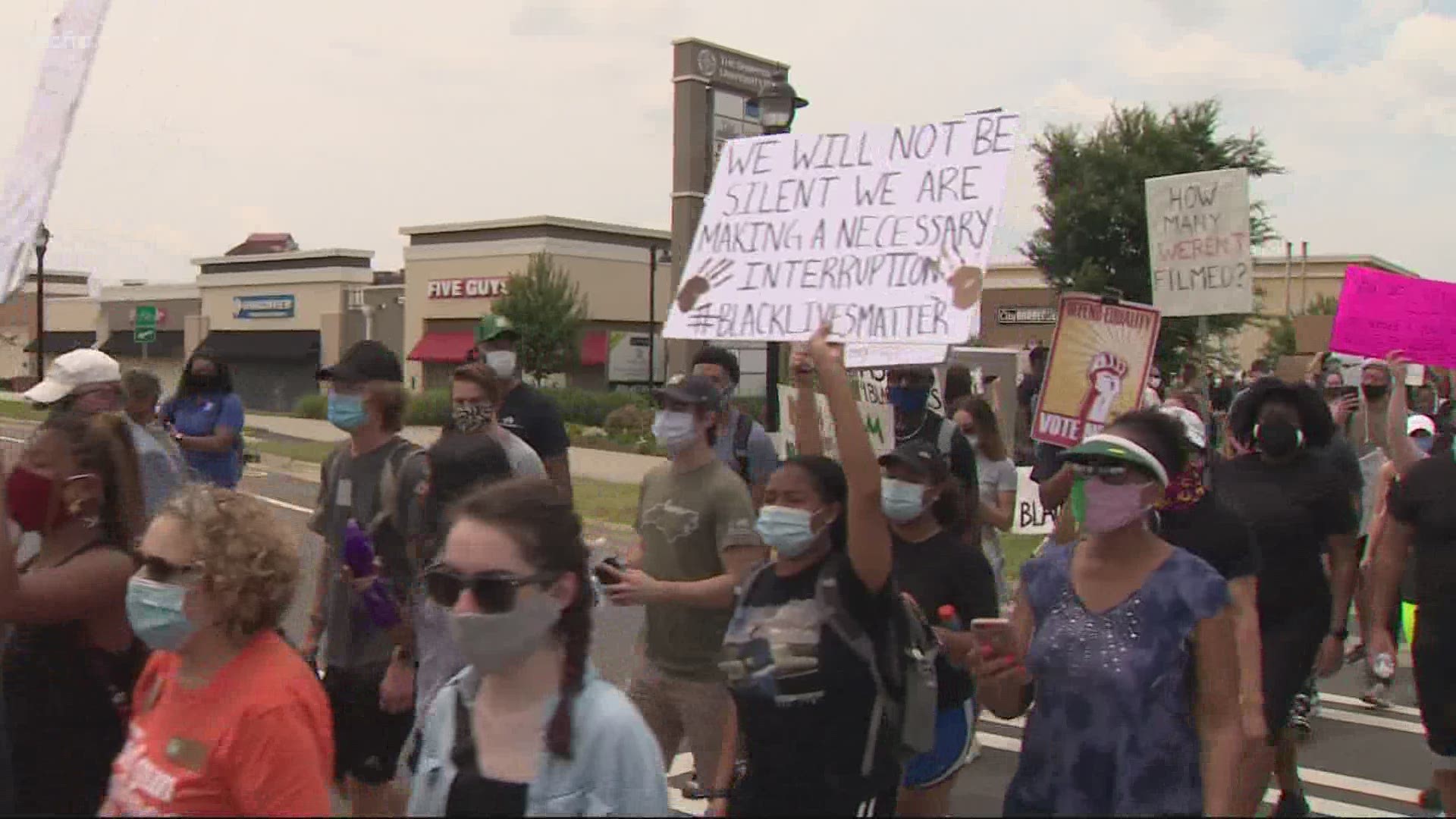 "We can't change if we don't come together." The march was organized by UNCC students with the hope of bringing the campus together in the cause.