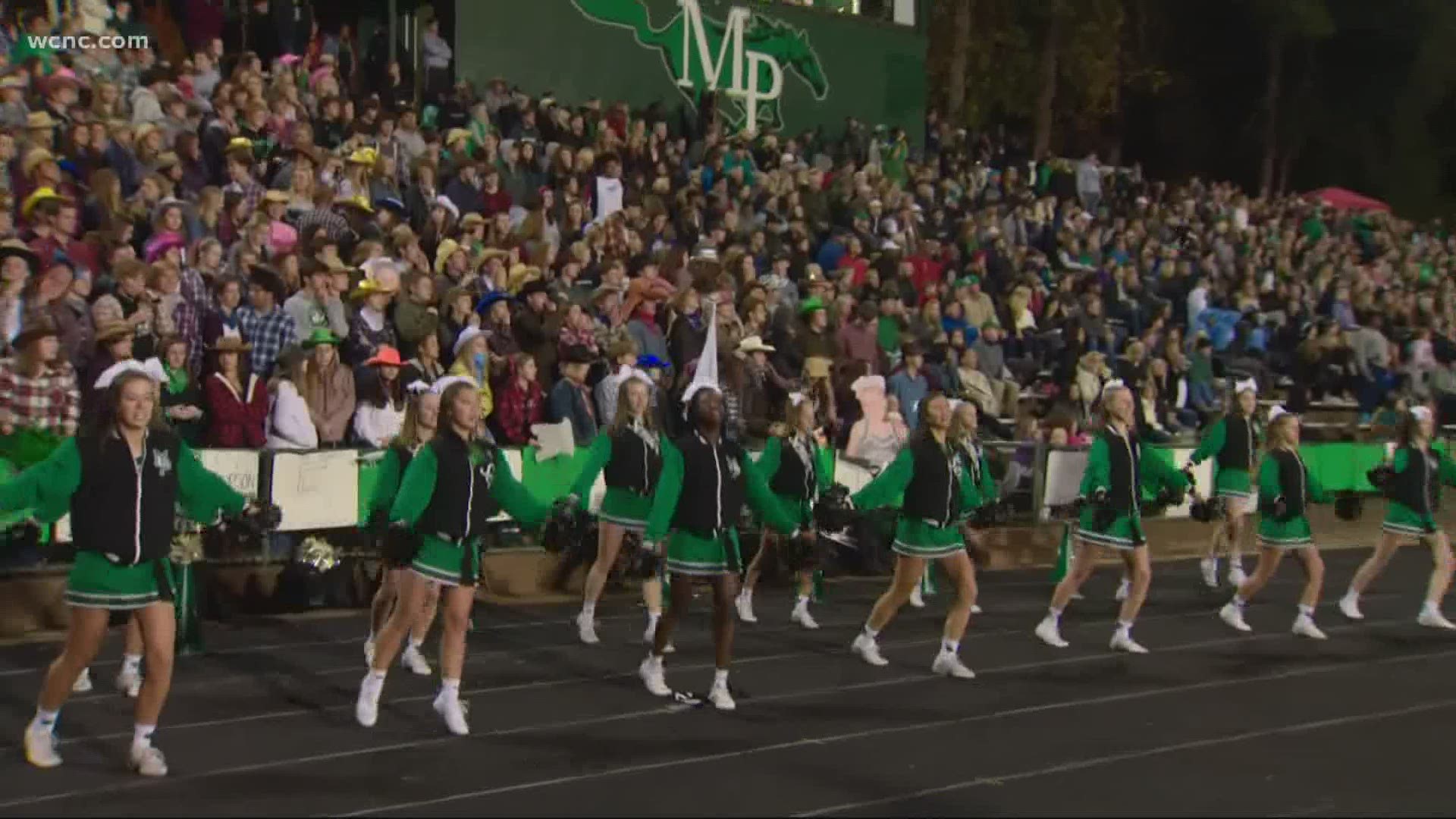 Starting Friday, Charlotte-Mecklenburg Schools will allow more parents and fans to attend outdoor spring sporting events, including football playoff games.