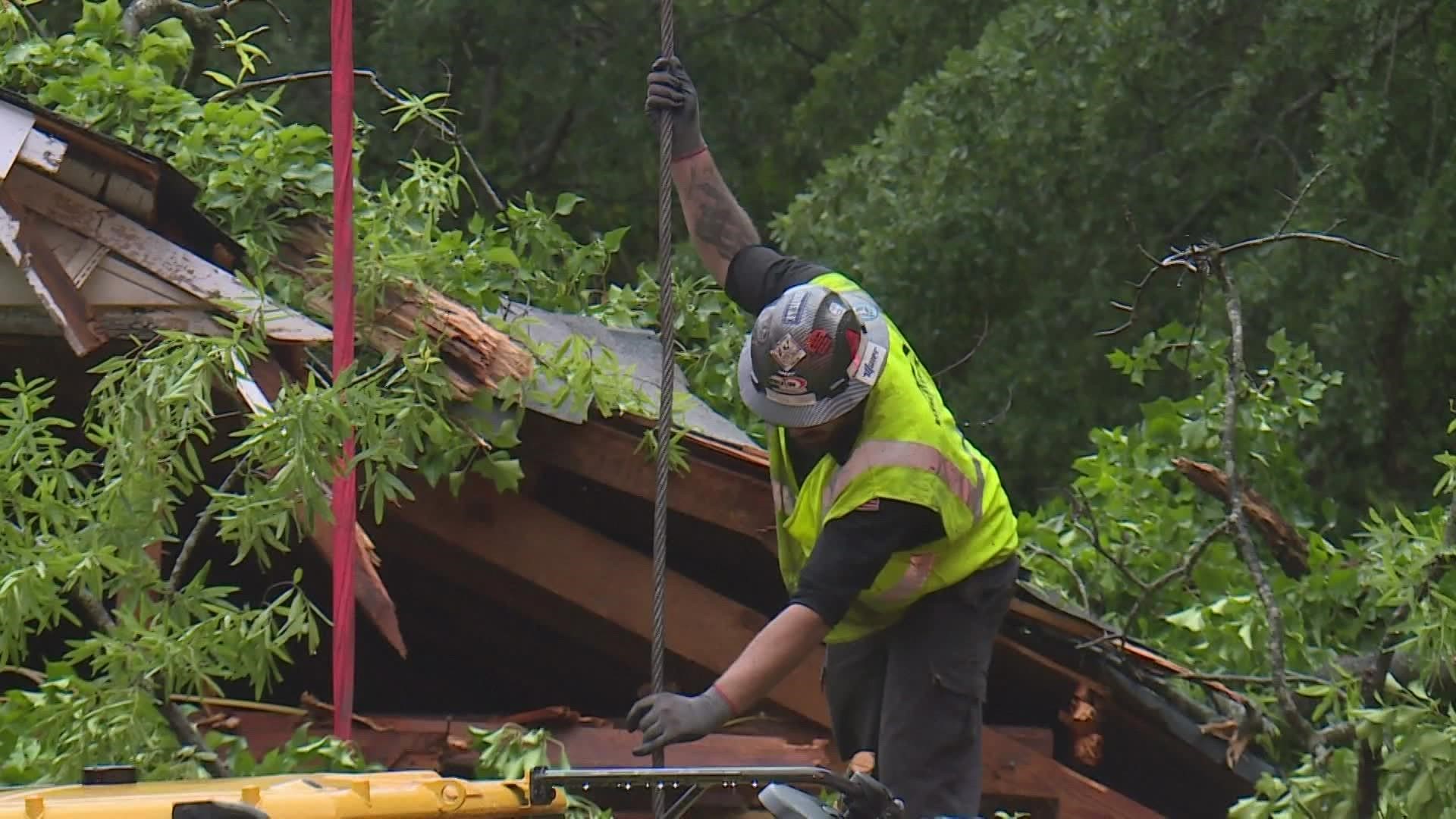 It took crews two hours to get the woman out of her home after a tree fell on it.