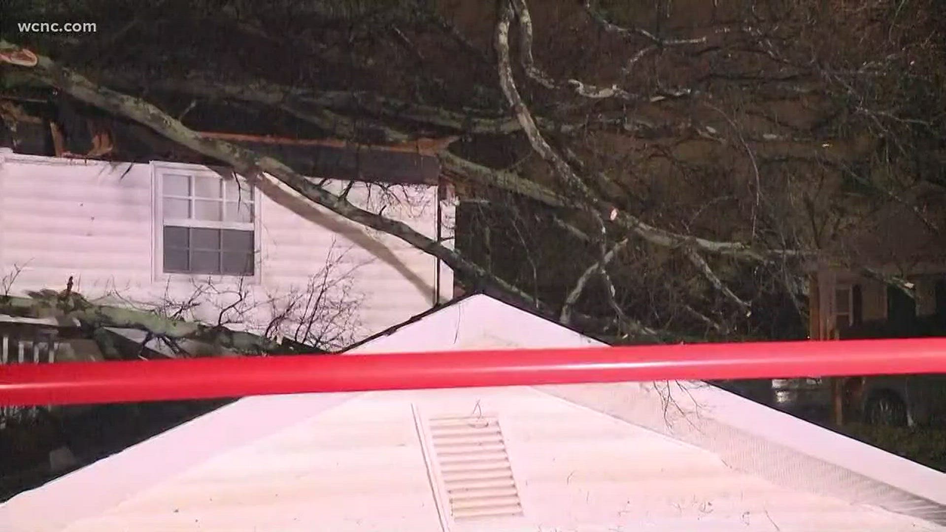 A massive tree crashed onto a home in northwest Charlotte early Monday morning.