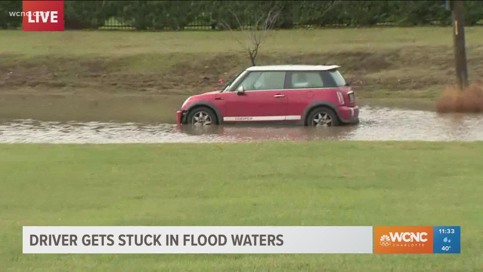 A man was rescued after his car stalled out on a flooded road in north Charlotte Monday morning.