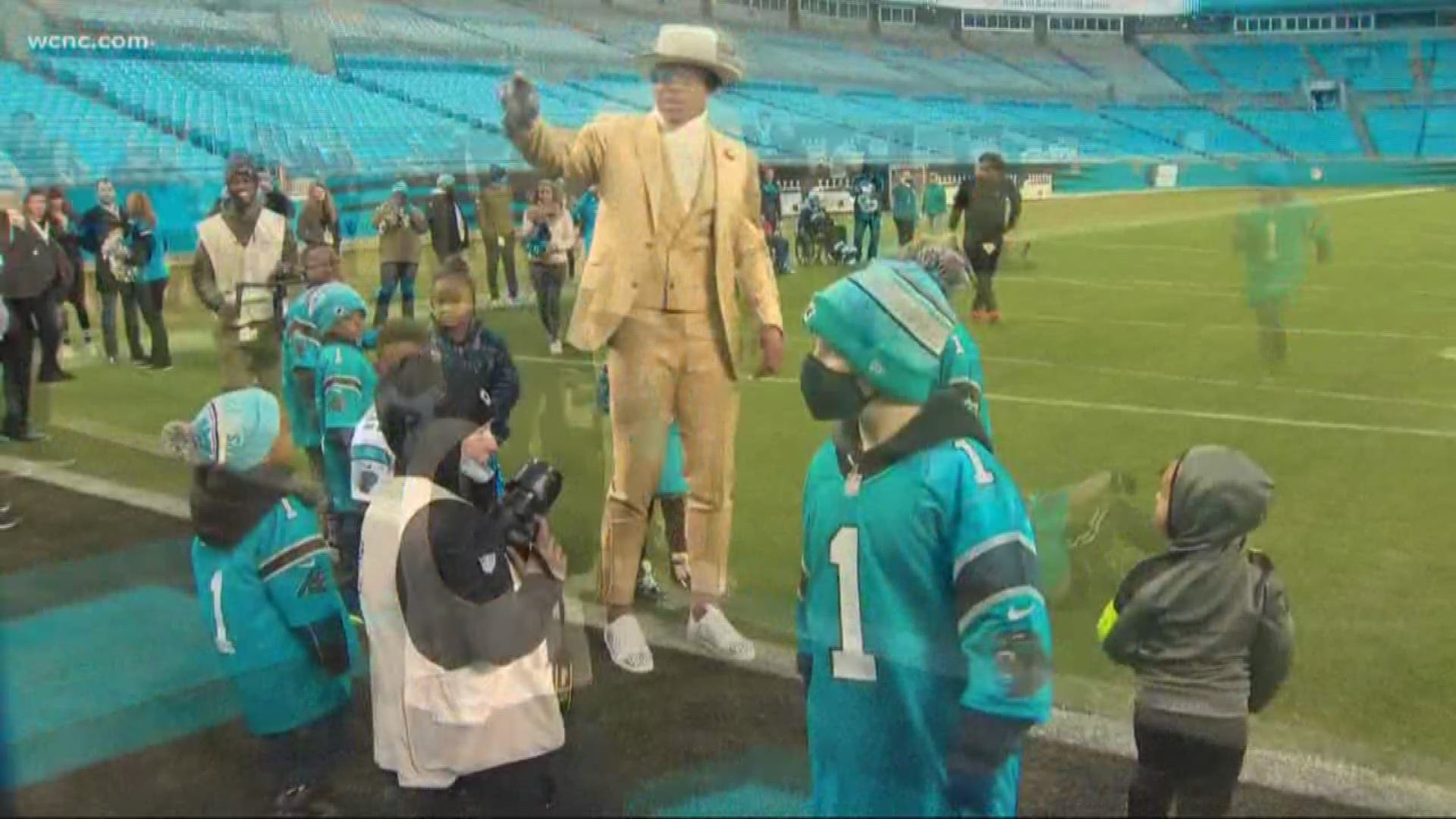 Even though Cam Newton didn't play, he was spreading some Christmas cheer after the game.