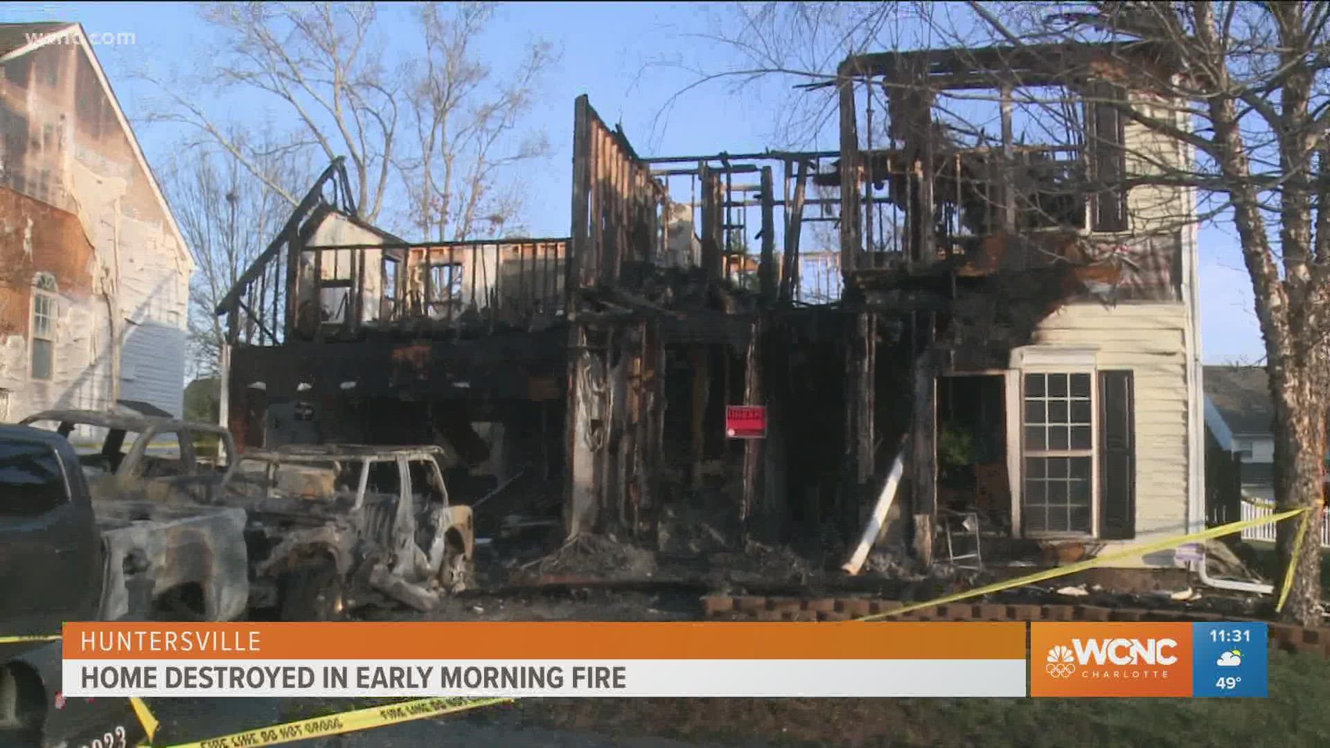 Fire destroys Huntersville home, 3 vehicles in driveway | wcnc.com