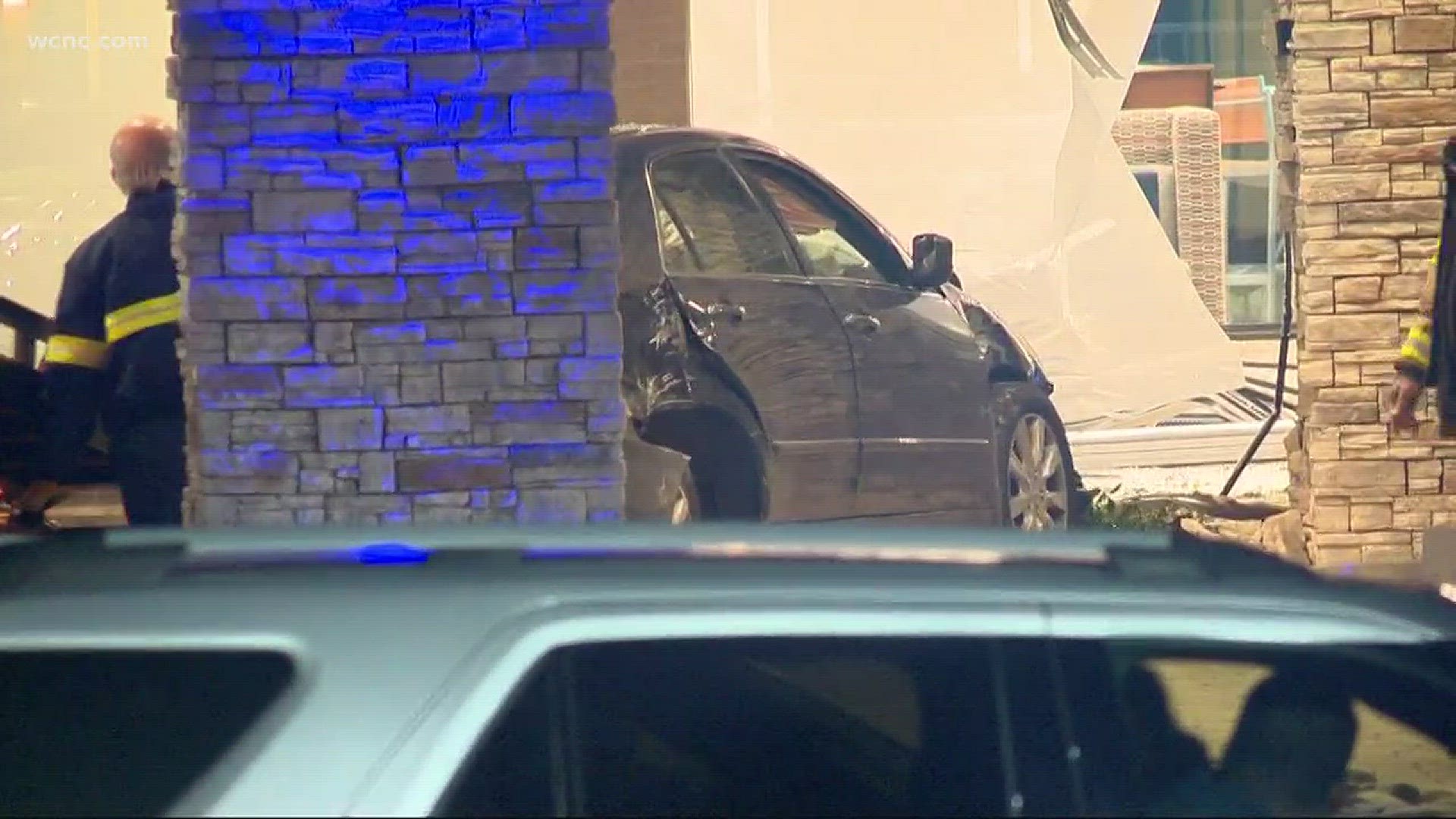 Medic says one person was rushed to the hospital after a car slammed into a hotel in north Charlotte.