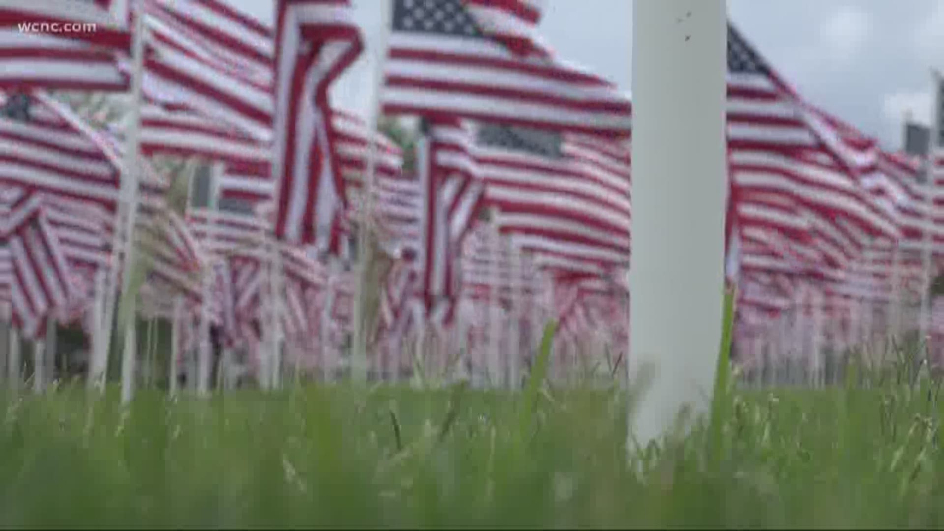 More than 40 volunteers set out Friday morning setting up the display at the Lowe's YMCA Field. Each flag represents a life and a story of bravery.