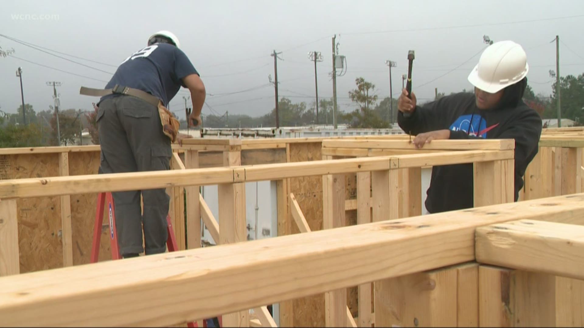 It's a trade program with a community outcome. Charlotte high school students are building a Habitat for Humanity home as hands-on training for the workforce.
