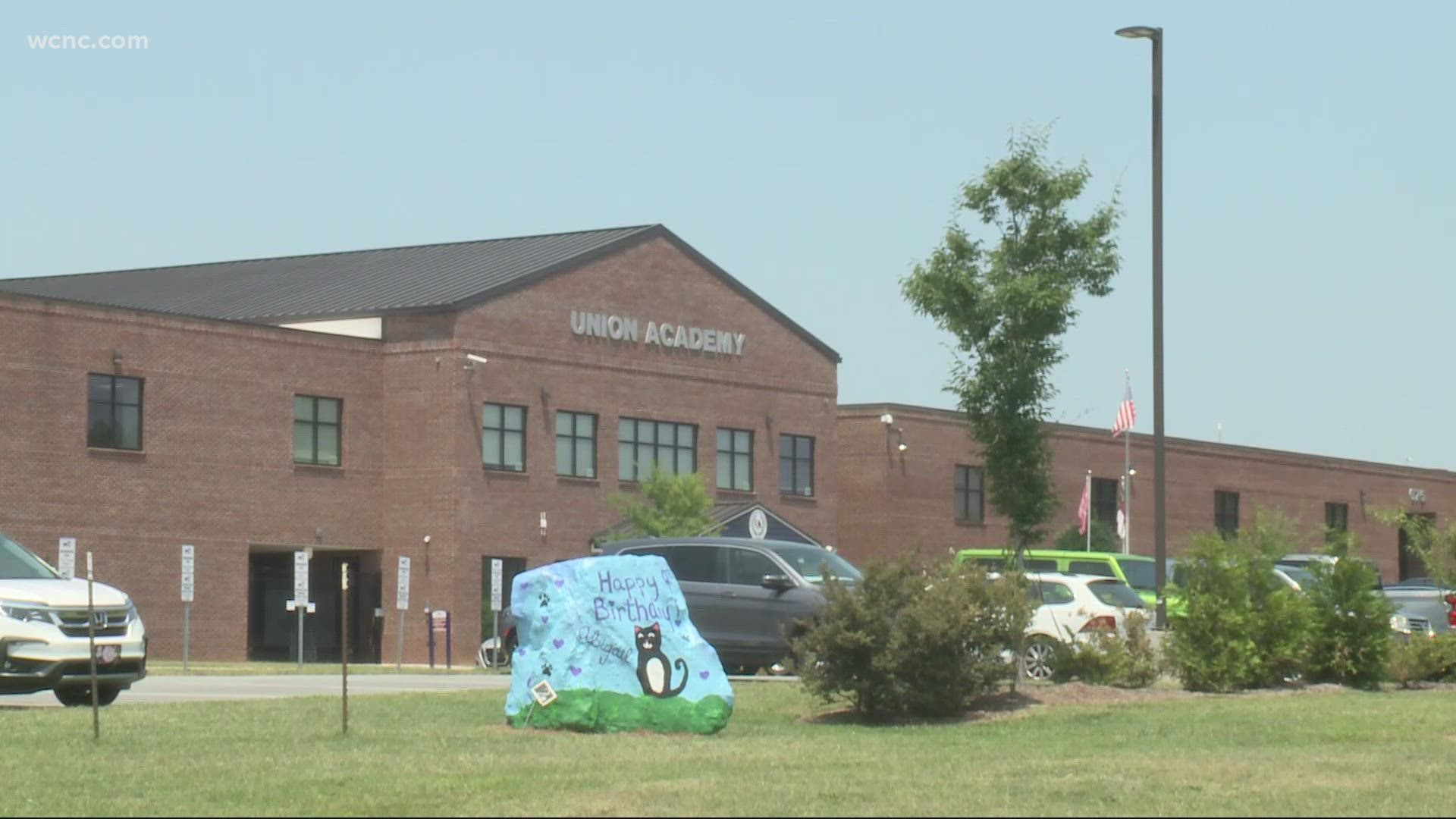 At least 14 people tested positive for the virus at Union Academy Charter School in Monroe. Roughly 150 students and staff are now in quarantine.