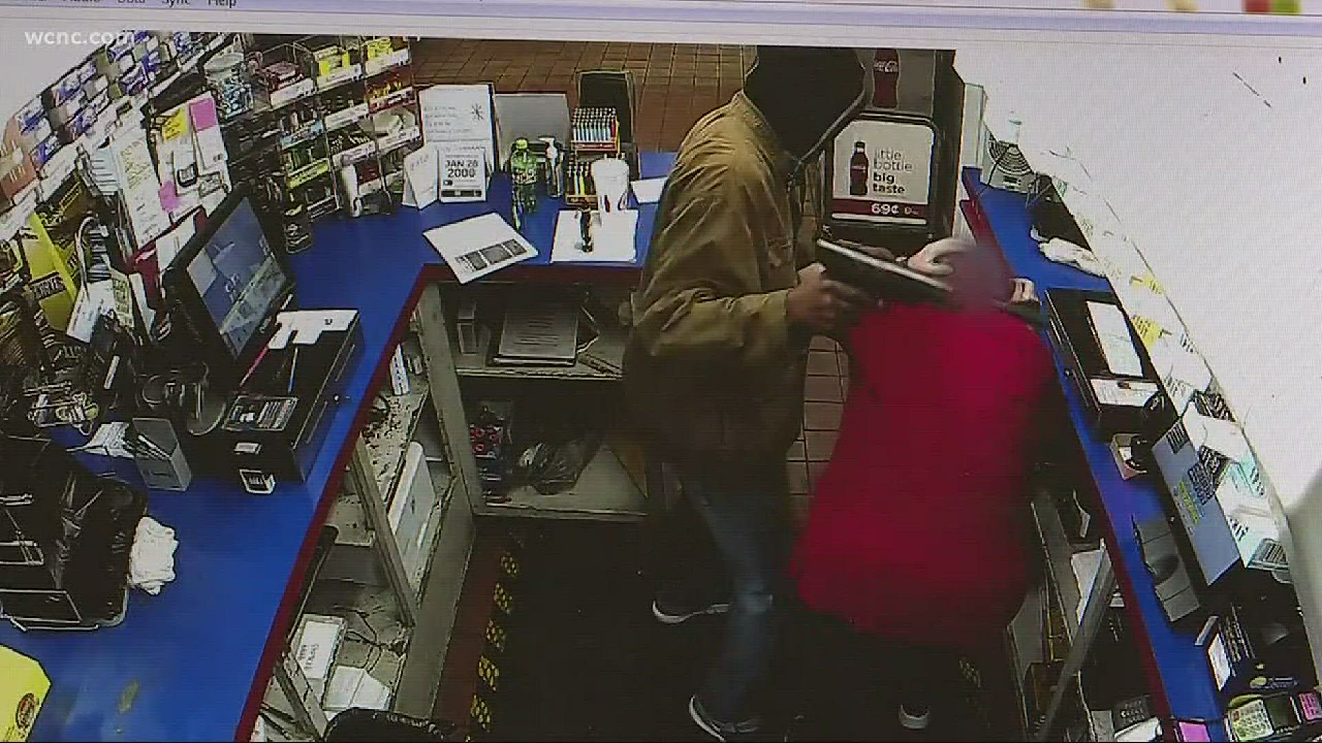 Dramatic surveillance video captures a gunman robbing a local convenience store and attacking a clerk and her teenage son right in front of the clerk's four-year-old grandson.