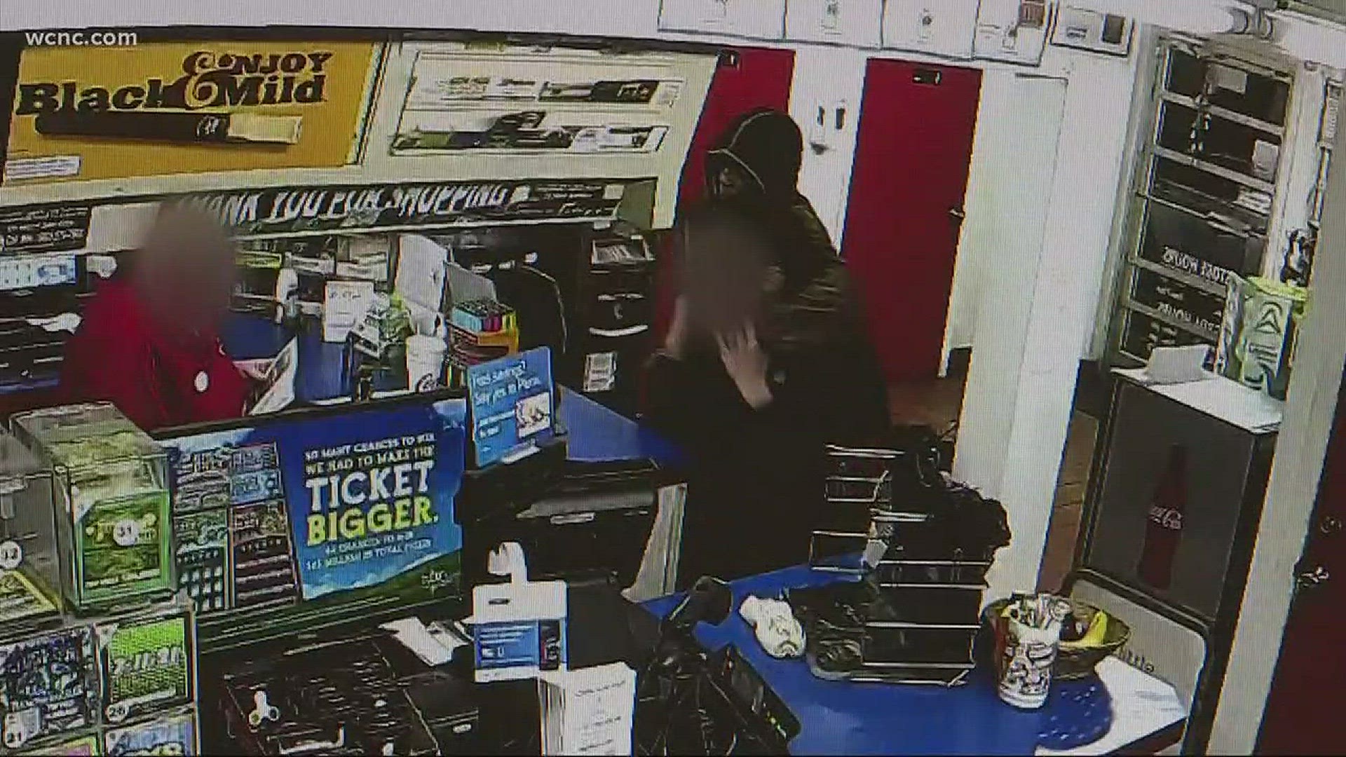 Shocking surveillance video captures a gunman robbing a local convenience store.