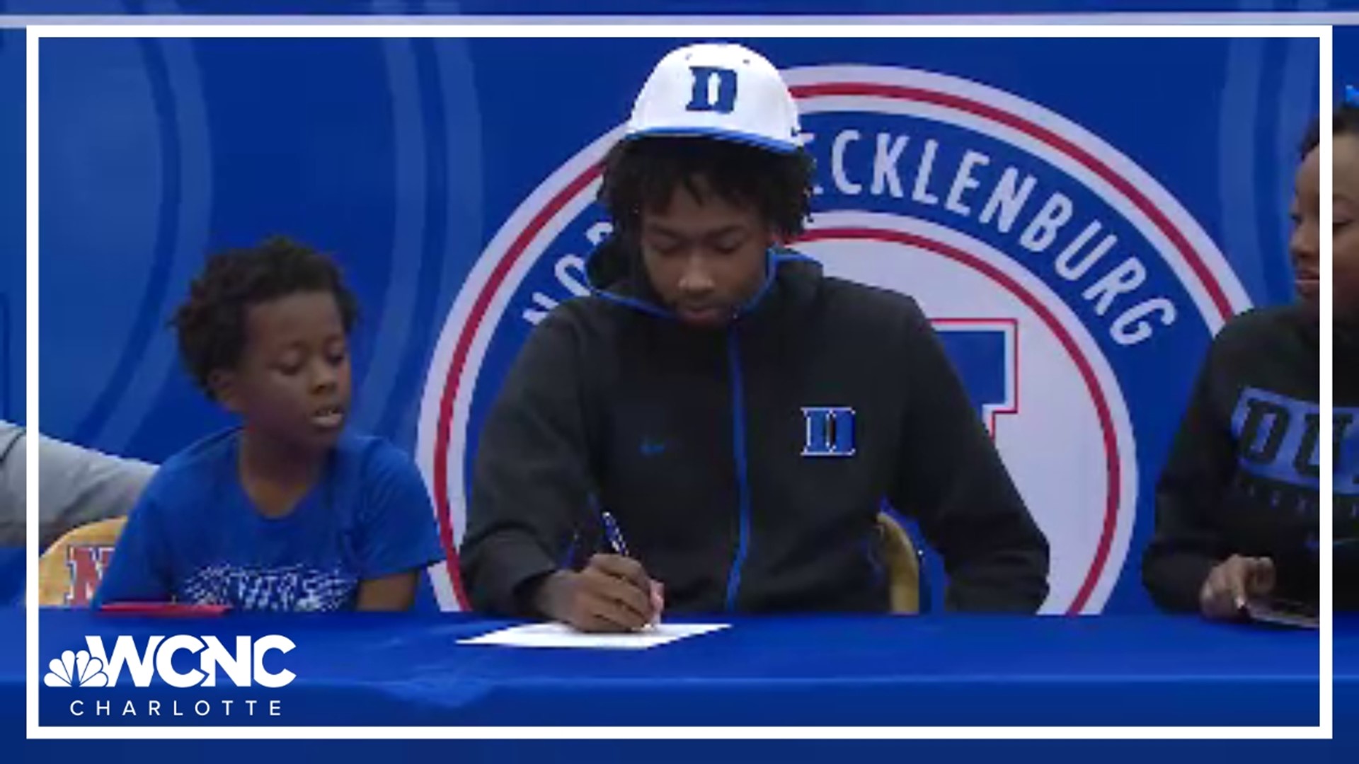 North Meck basketball star Isaiah Evans discusses why he's signing with Duke, being recruited by Coach Jon Scheyer, and playing in the Duke-UNC rivalry game.