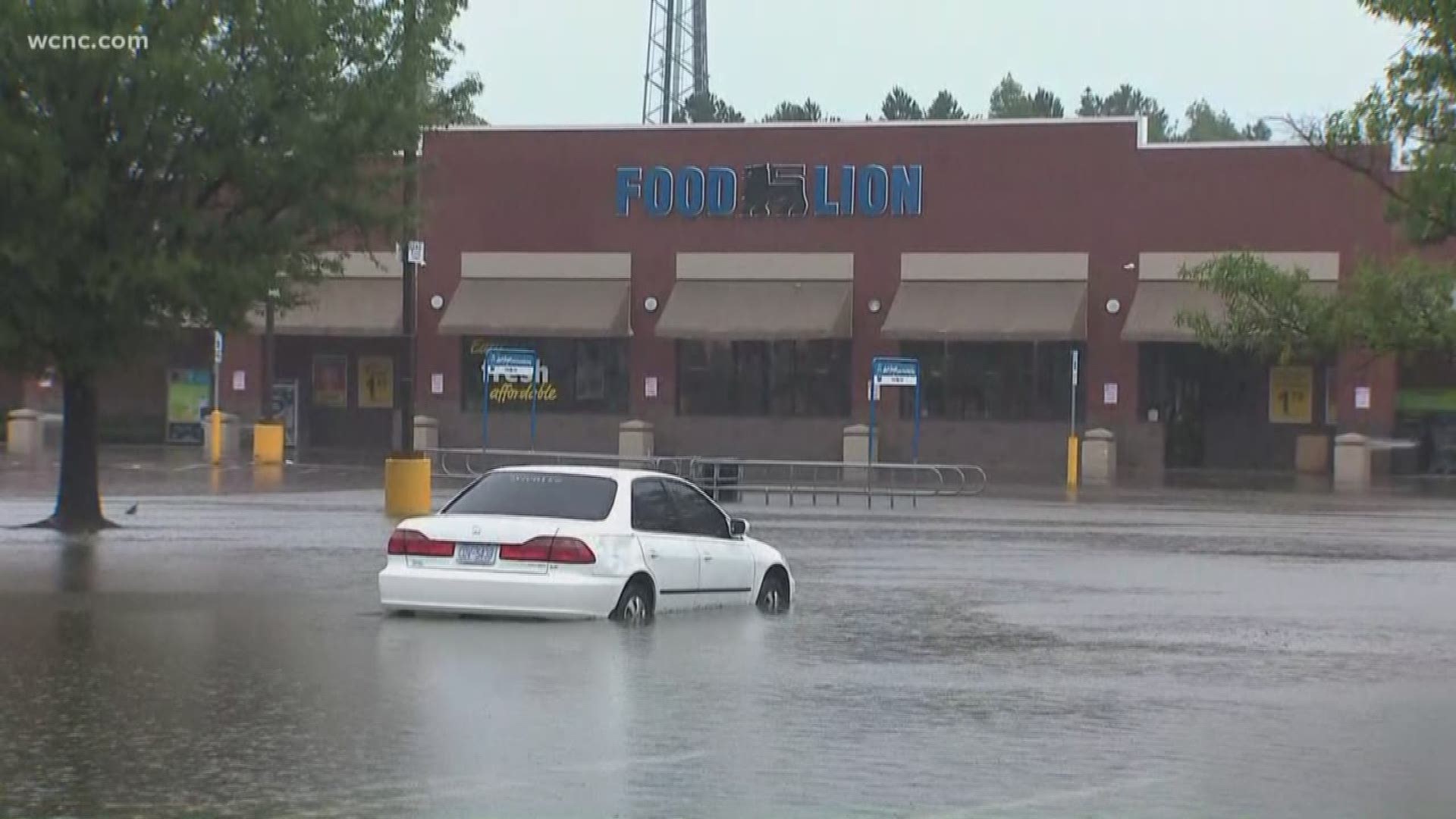 A woman was rescued from a grocery store parking lot in Monroe while she was trying to get juice for her baby.