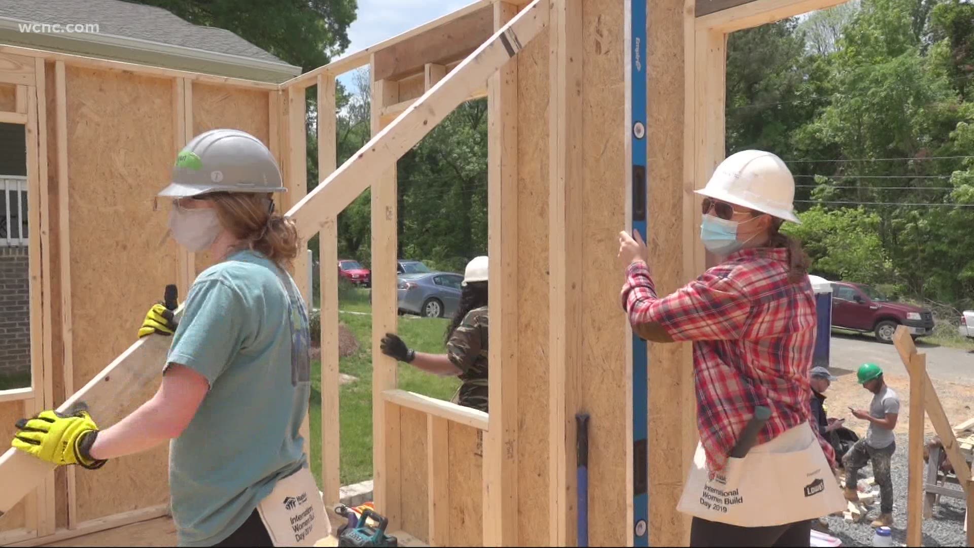 Taneesha Gleaton and volunteers with “Women Build” rolled up their sleeves on Saturday to continue work on a Habitat for Humanity House.