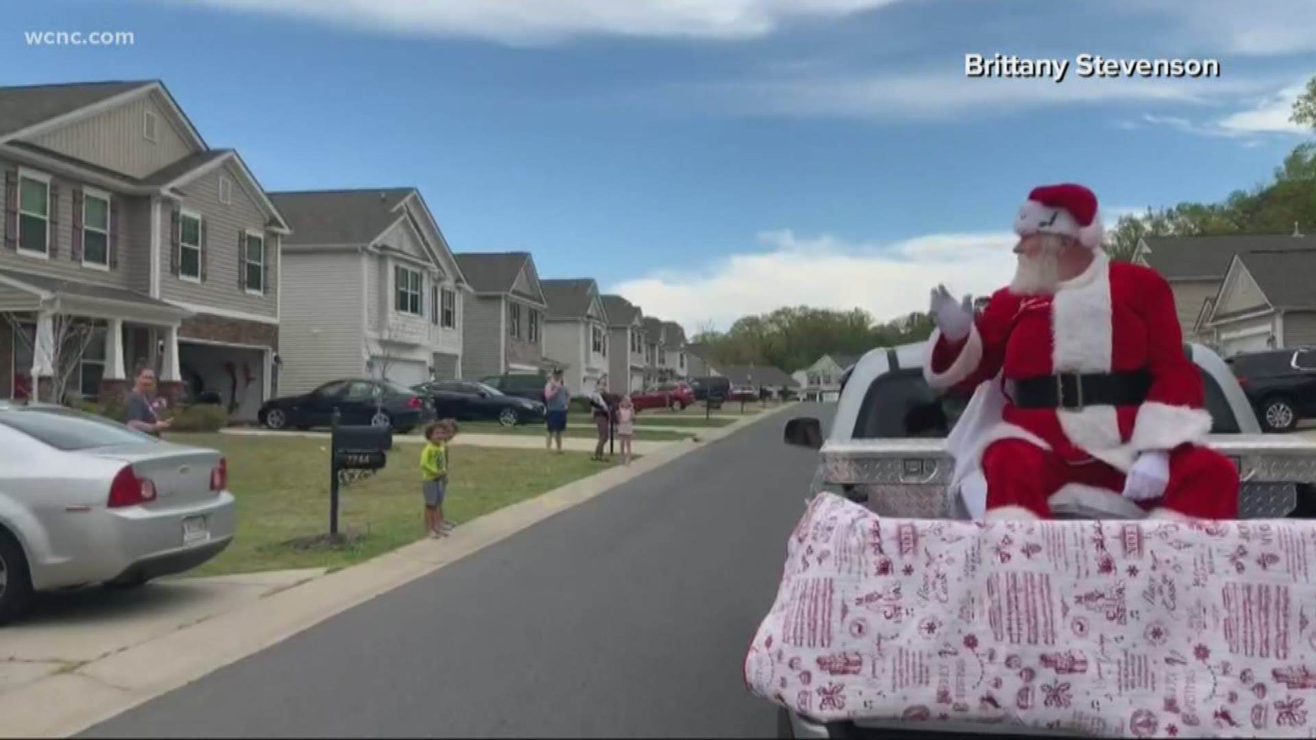 Santa practiced social distancing, taking a ride down the streets in the back of pickup truck.