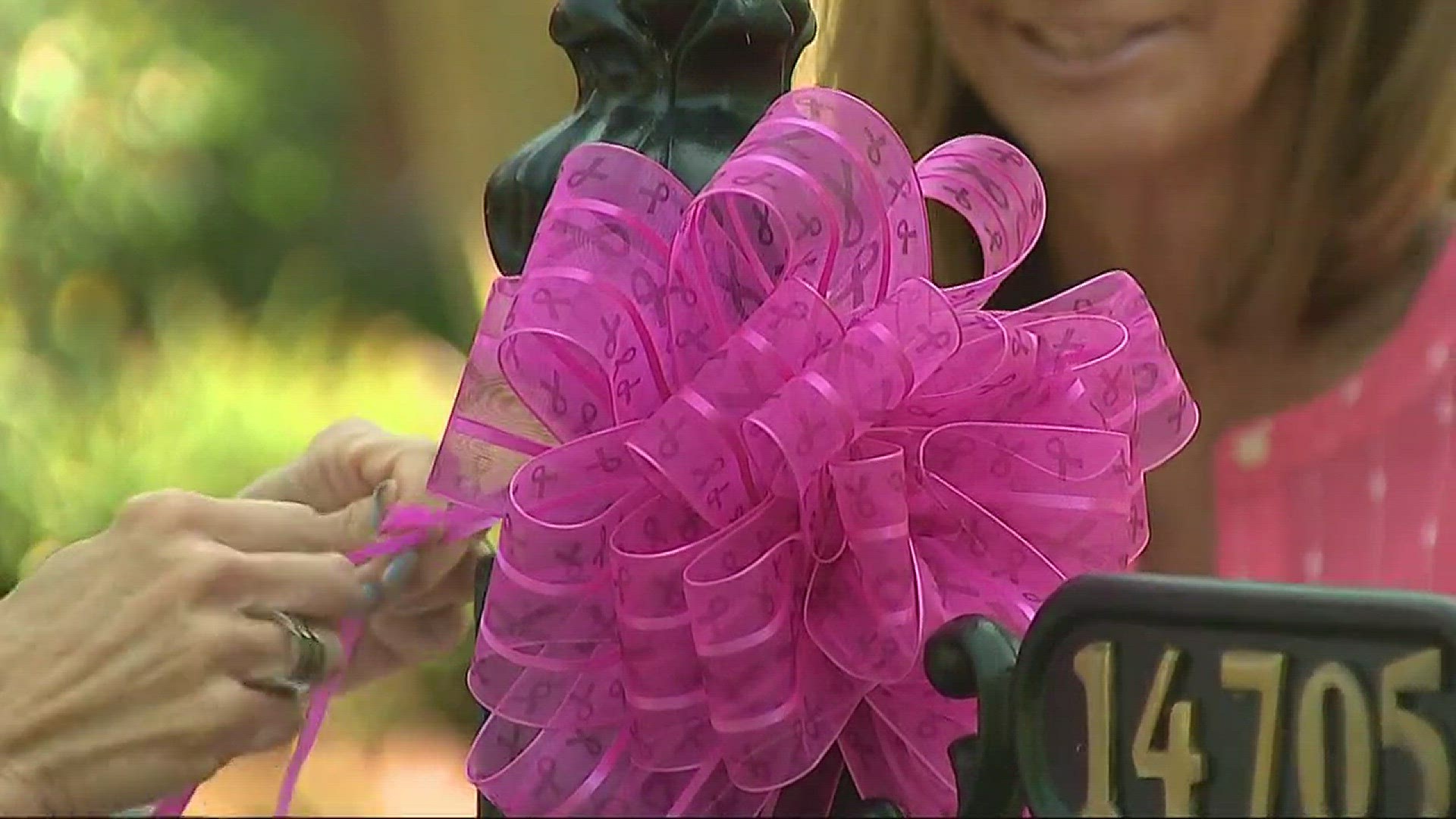 With pink ribbons in hand the Ballantyne Country Club tied 'hope' to their neighbors Friday. October marks the start of Breast Cancer Awareness Month.