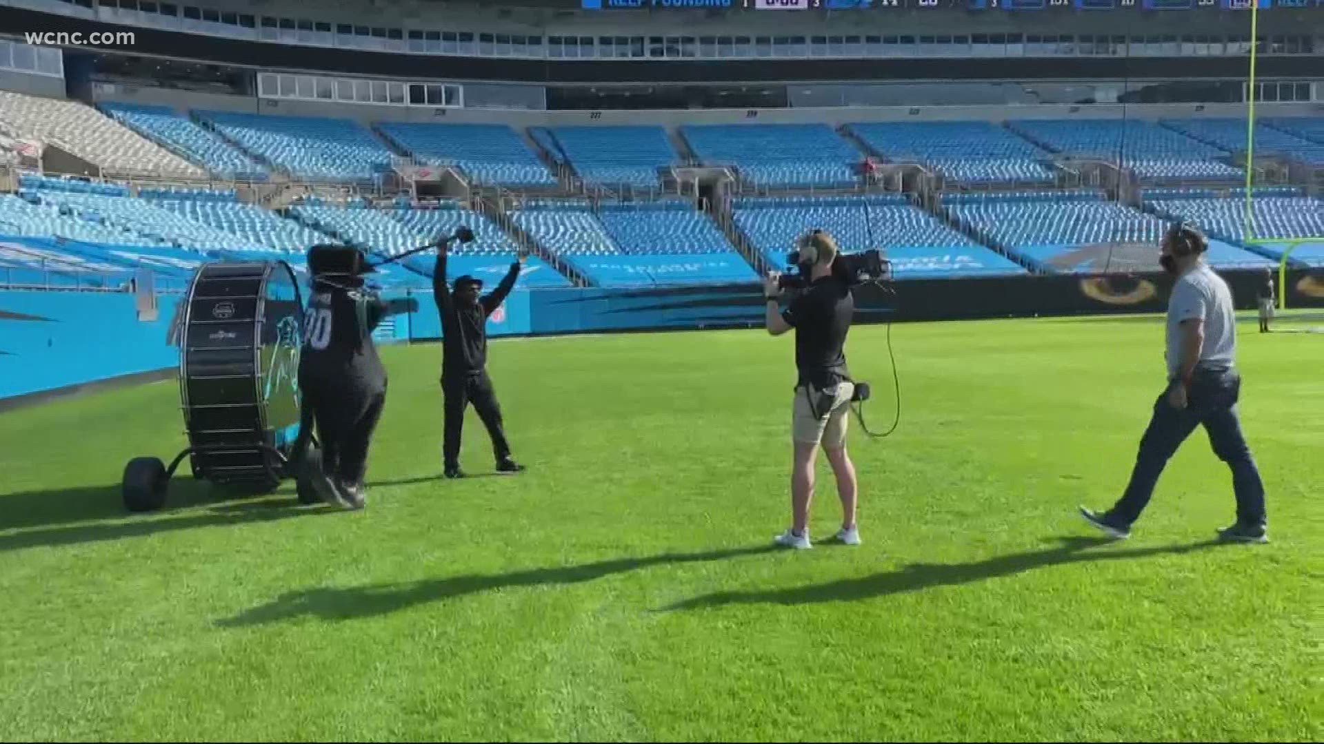 Ronnie Long, a wrongfully convicted North Carolina man, beats the Carolina Panthers drum ahead of Sunday's game in Charlotte.