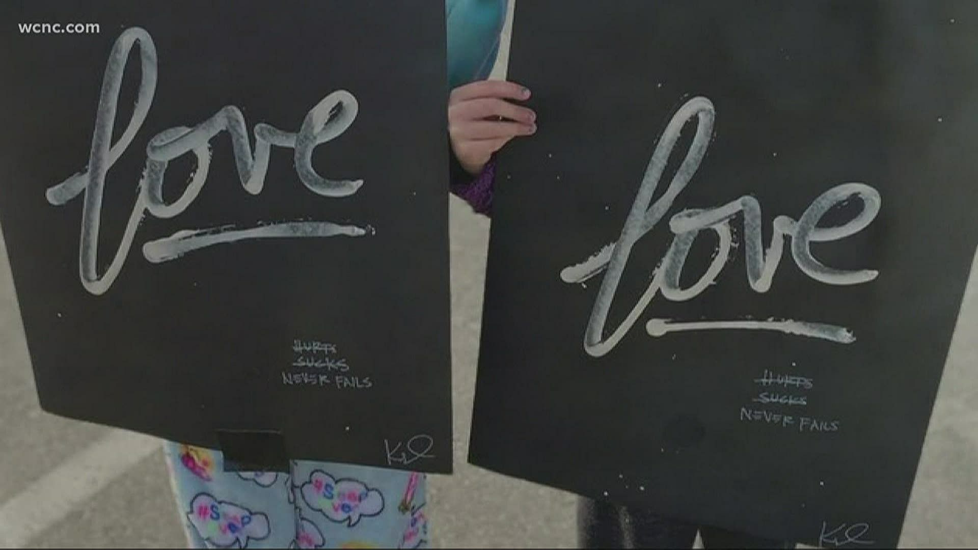 Artist used his energy to literally spread the love posting painted canvas around the city.