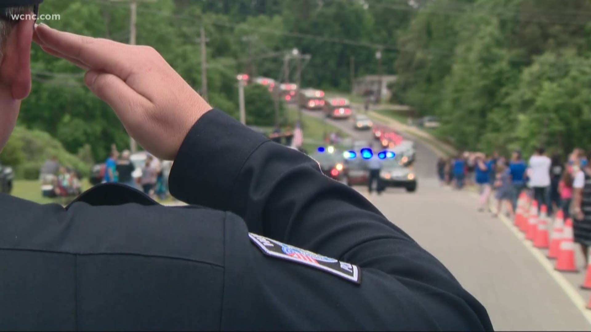 Hundreds watch the procession to show their respect, love and appreciation for Officer Sheldon, his family, friends and the entire Mooresville community.