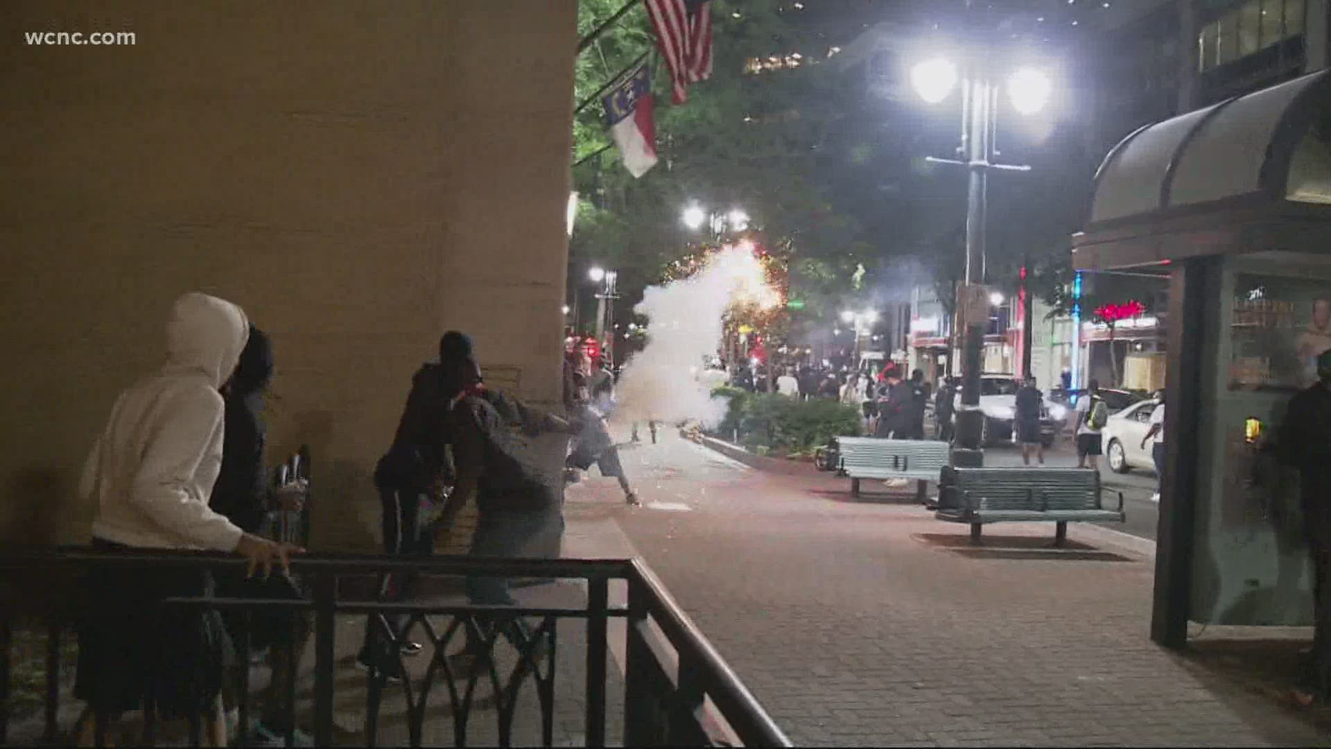 Explosions and tear gas, protesters ran through uptown after protest Tuesday night.