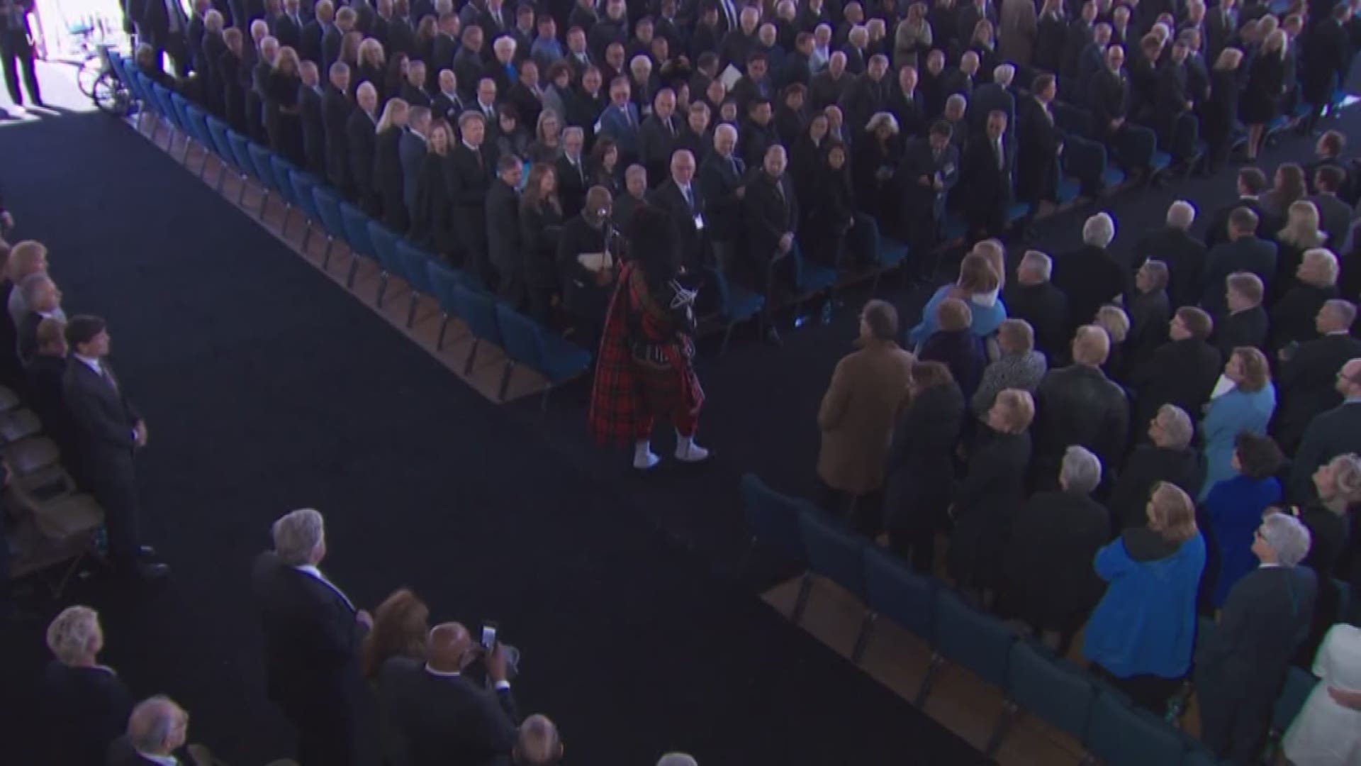 Rev. Billy Graham's casket is escorted with his family to the Prayer Garden where he will be buried next to his wife, Ruth.