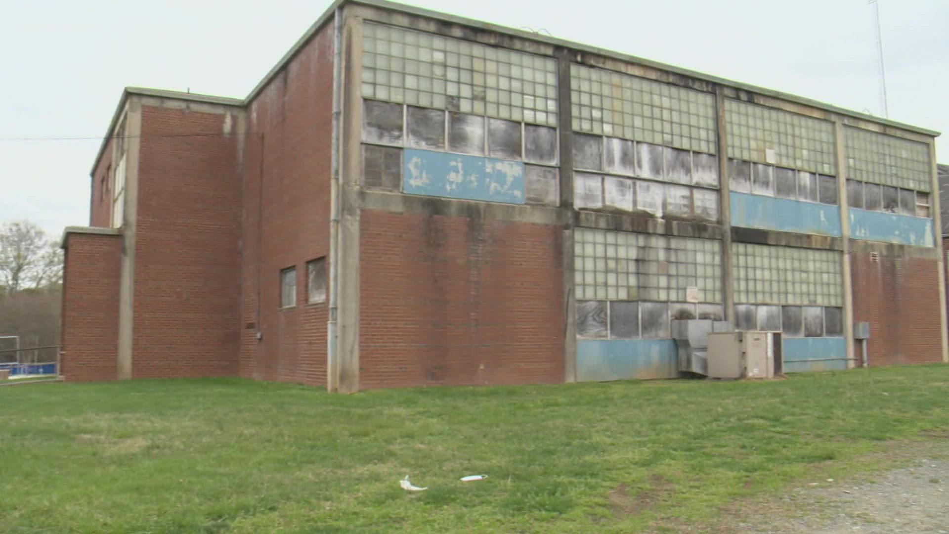 Two Charlotte teachers have filed a lawsuit after their attempts to buy the historic Torrence-Lytle School in Huntersville were unsuccessful.