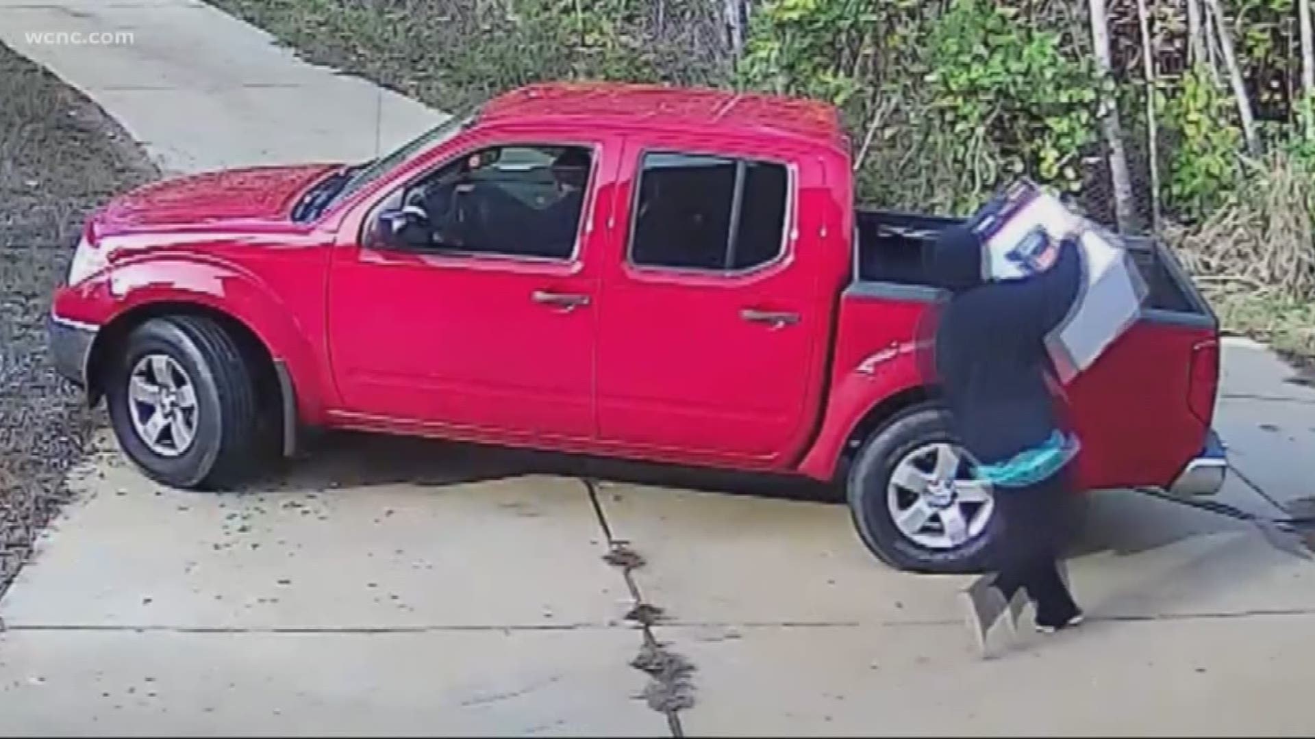 Police posted home surveillance video of what they say it a couple stealing a package off of someone's front porch.