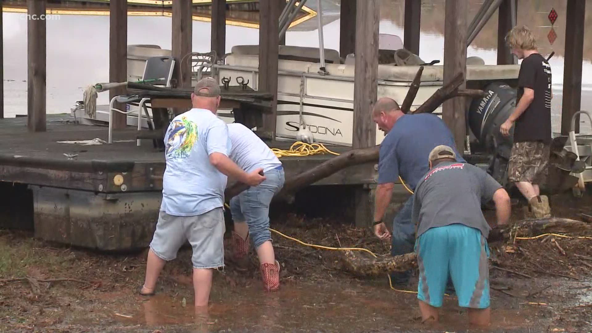 Owners are reunited with their boat, which floated away during flooding in Catawba County Thursday.