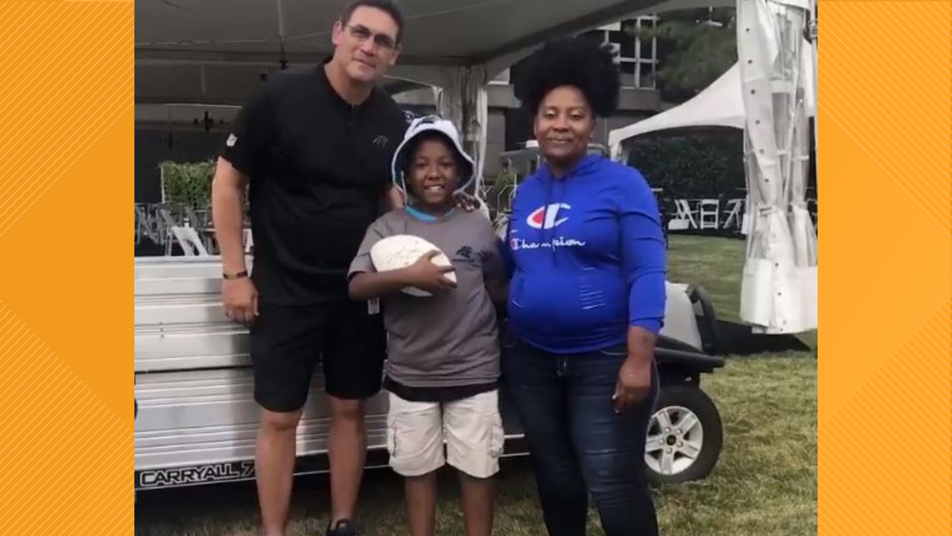 Jaylin got a brand new Panther blue colored lawnmower, an official Panther grounds crew t-shirt and to top it off and autograph football by Cam Newton.