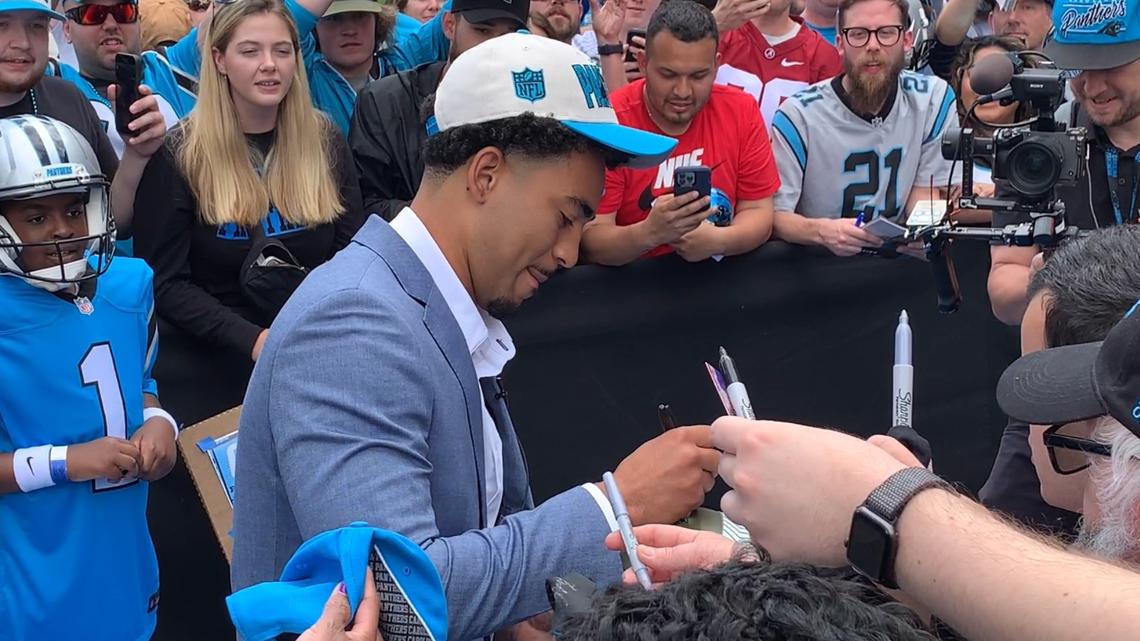 Welcome! QB Bryce Young greets fans at BofA Stadium