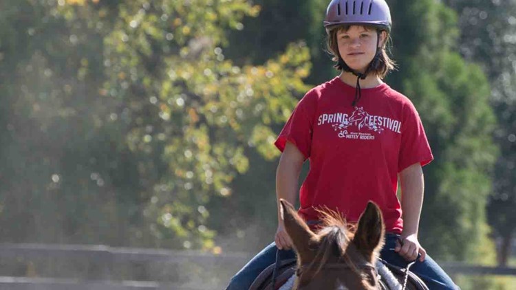 Therapeutic horseback riding helps kids with special needs