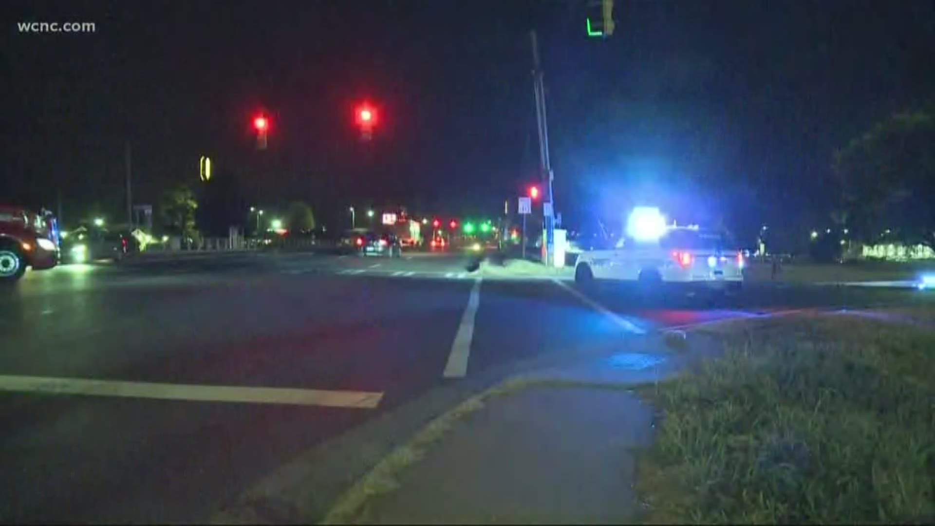 CMPD is searching for a driver who dragged a man more than a thousand feet while he was holding onto the side of a car.