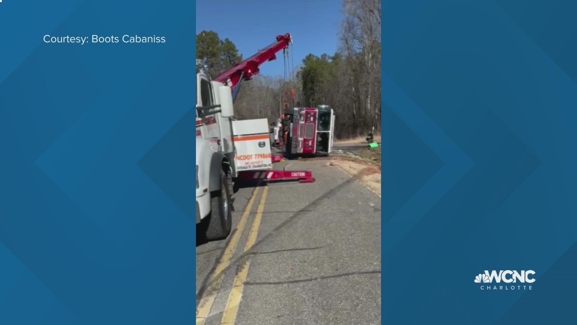 WCNC Charlotte viewer Boots Cabaniss captured video of crews getting a crashed fire engine back upright.