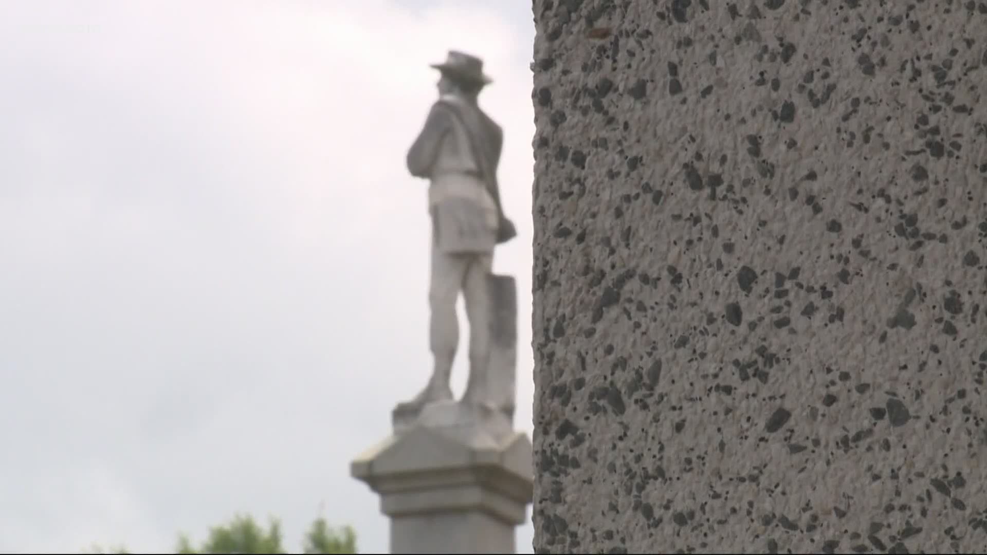 County commissioners originally agreed to pay for its removal and give the monument to the Sons of Confederate Veterans. Now, plans have come to a halt.
