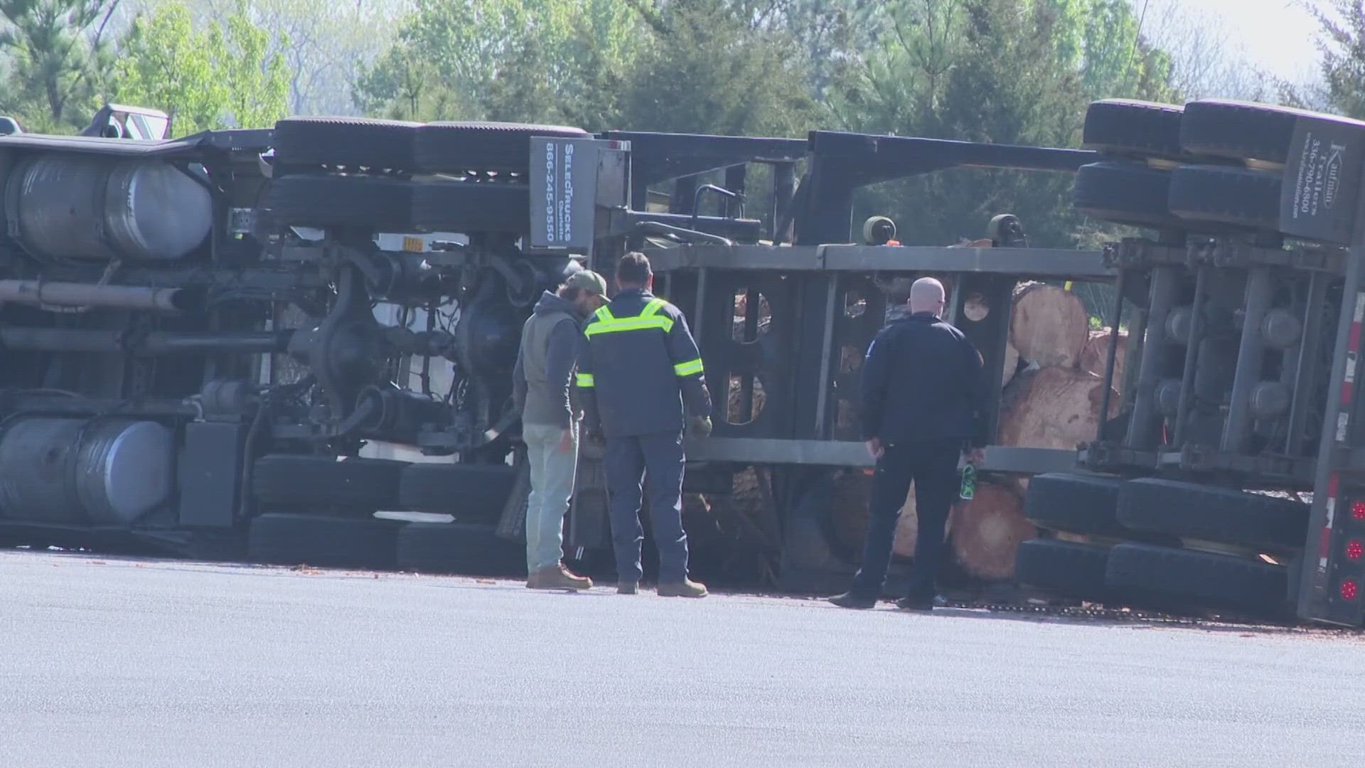 A section of University City Boulevard was closed by an overturned logging truck on Wednesday.