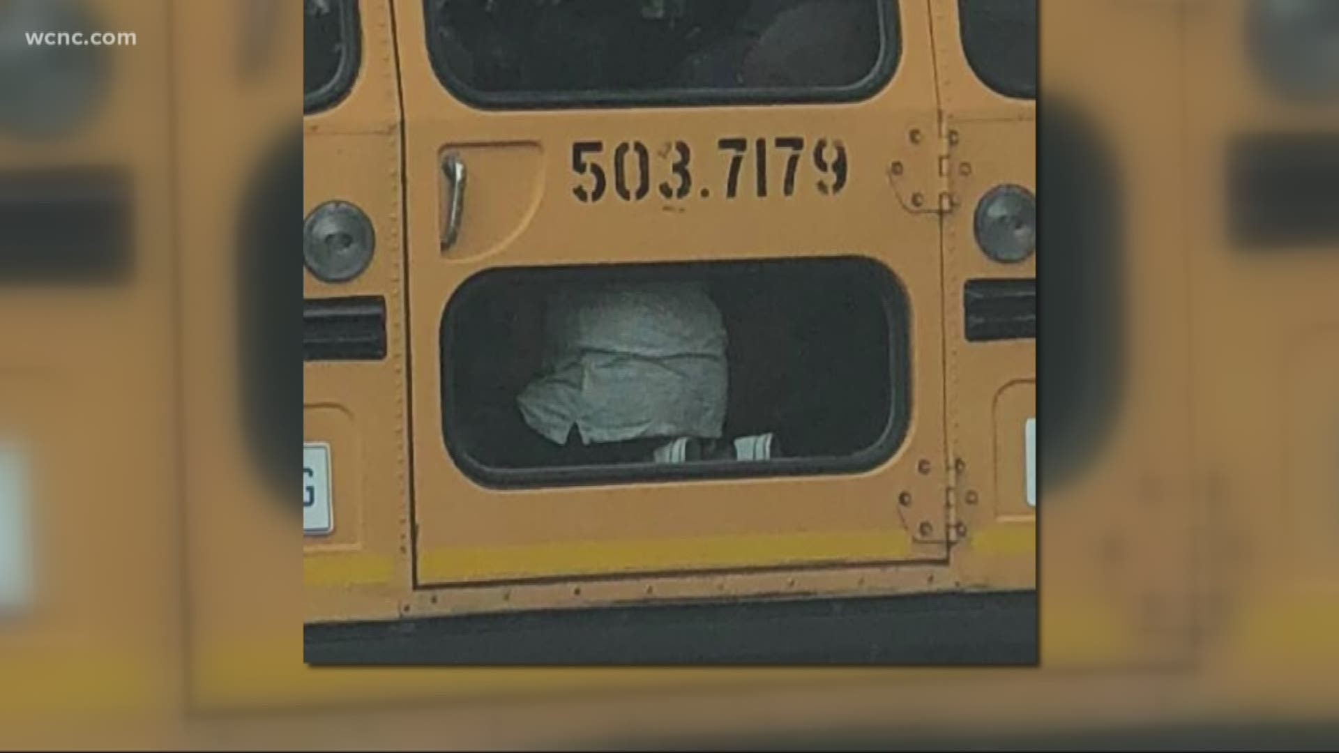 Viral picture shows student kneeling in aisle of school bus