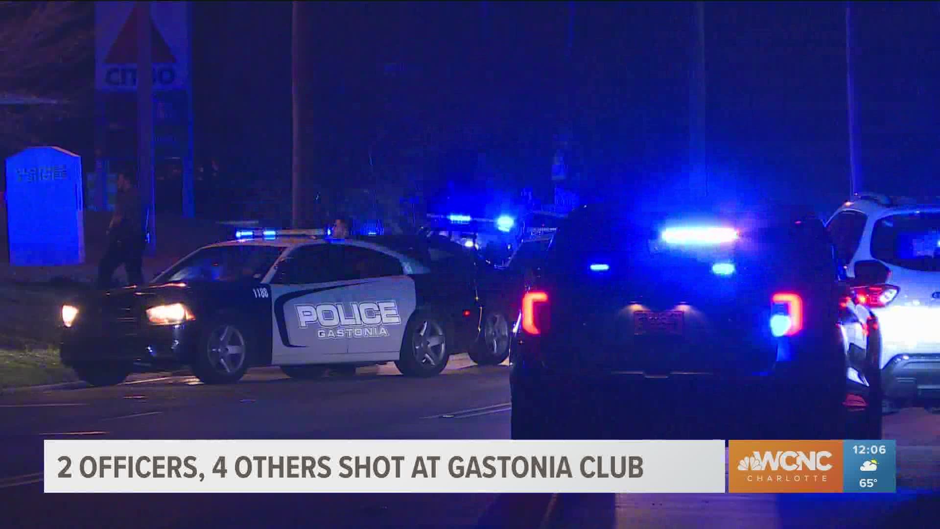 Six people, including two police officers, were shot at a nightclub in Gastonia late Thursday, police said. Two men have been charged in the shooting.