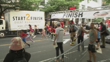 'Help them get a better life' | Runners take to Uptown on a twilight 5K for the kids